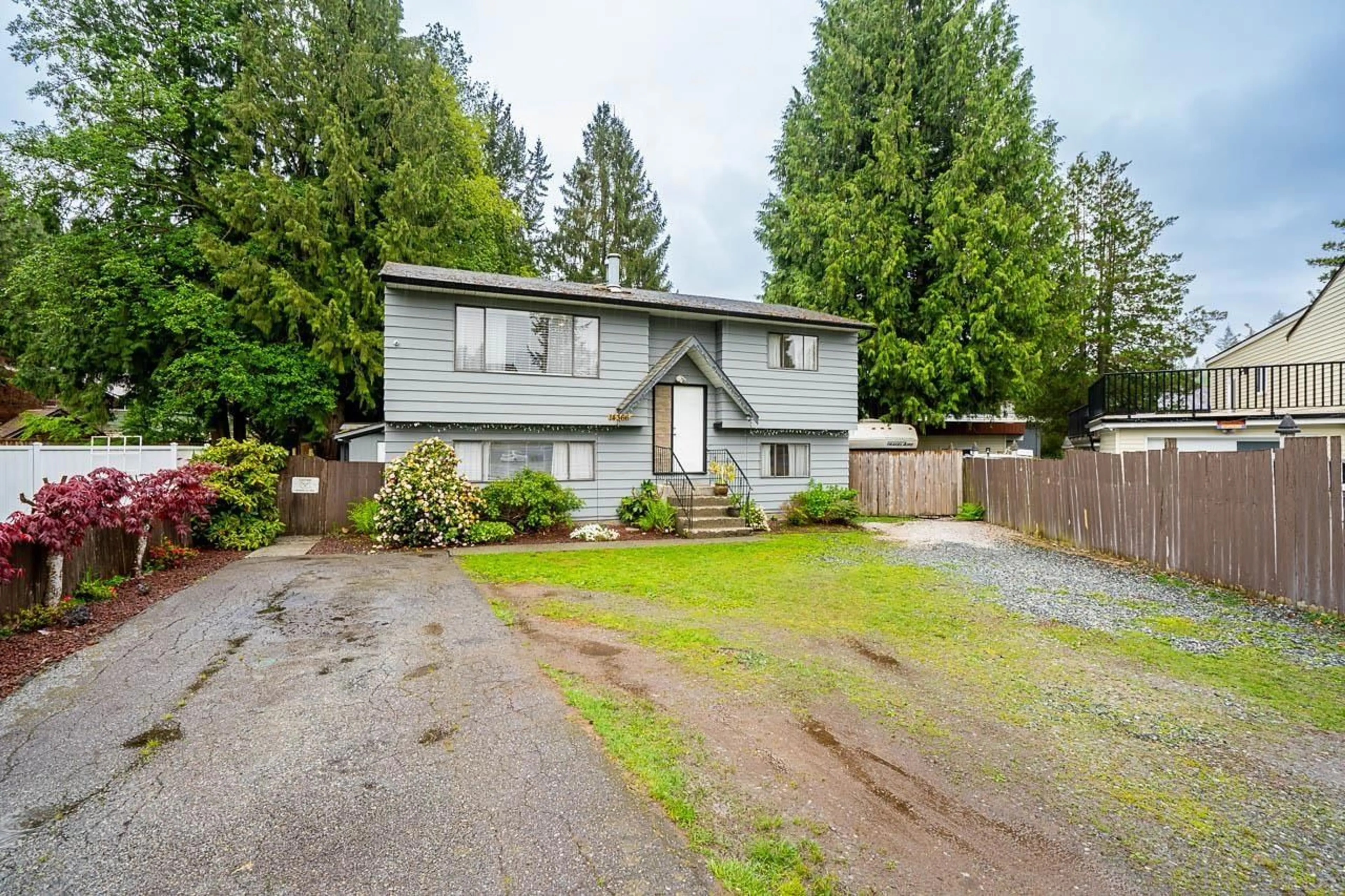 Home with vinyl exterior material, street for 14366 101, Surrey British Columbia V3T5C8