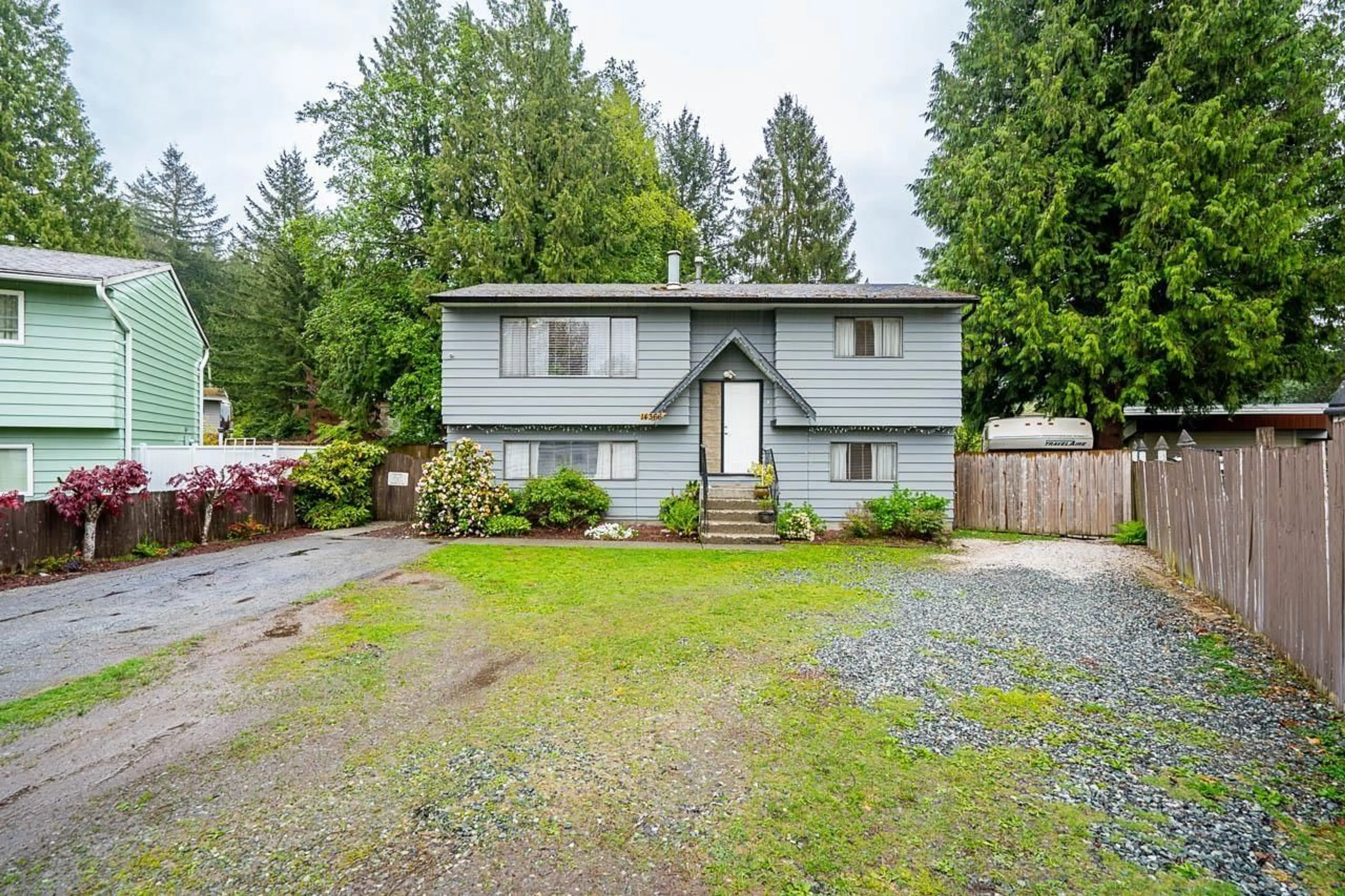 Home with vinyl exterior material, street for 14366 101, Surrey British Columbia V3T5C8