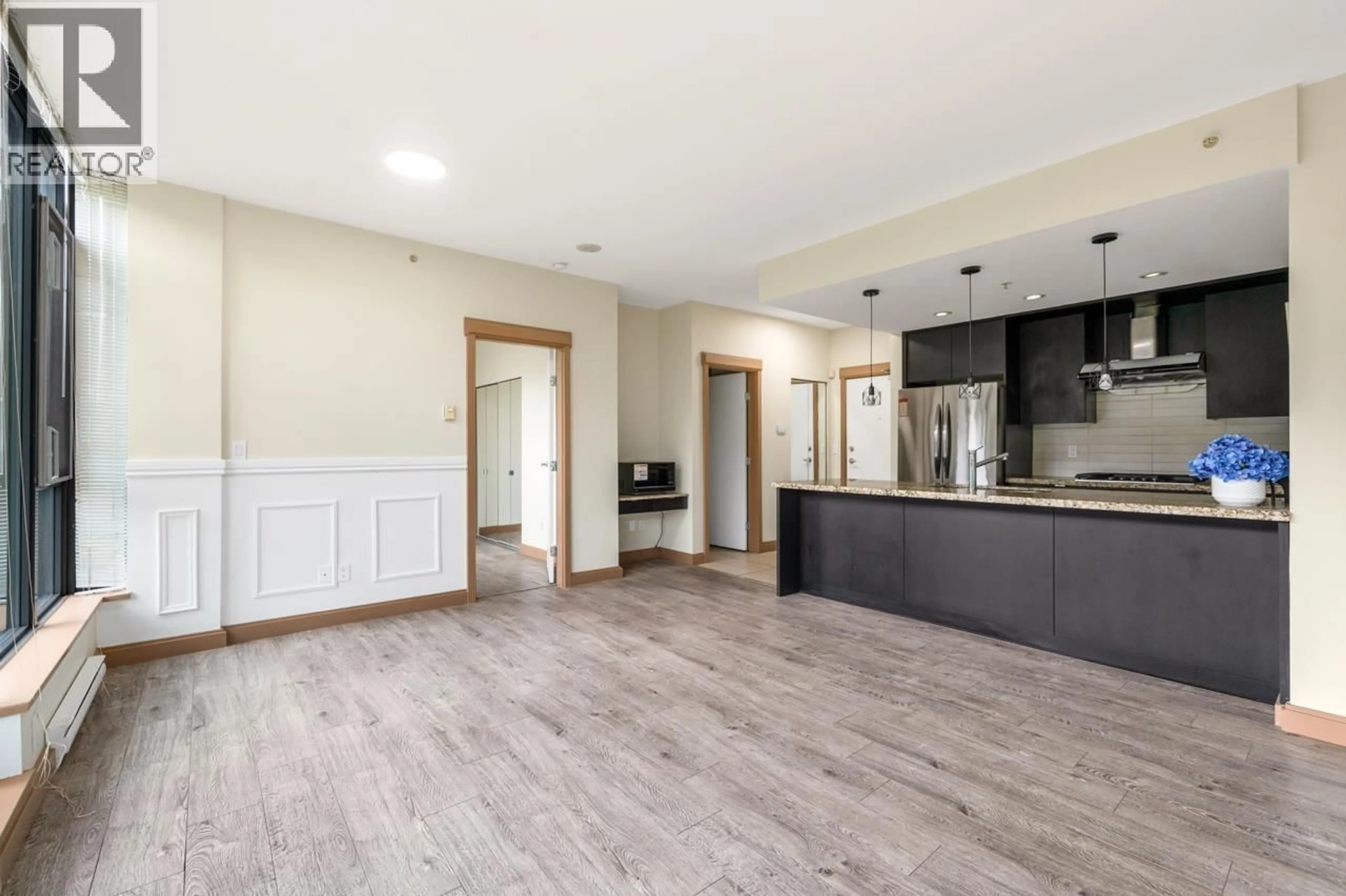 Open concept kitchen, wood/laminate floor for 307 - 7088 18TH AVENUE, Burnaby British Columbia V3N0A2