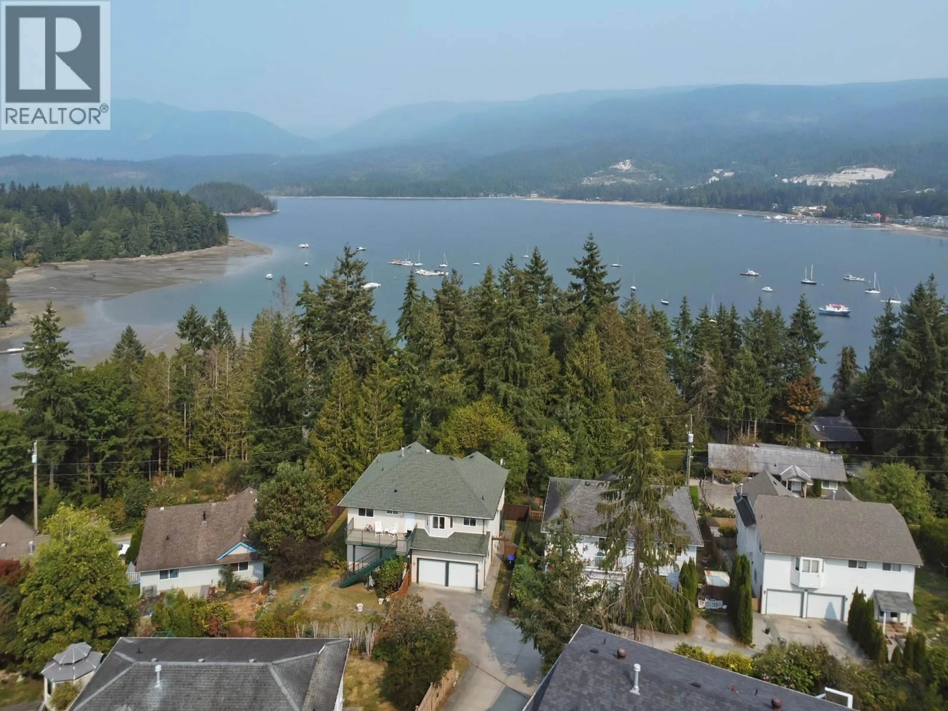 A pic from outside/outdoor area/front of a property/back of a property/a pic from drone, water/lake/river/ocean view for 5866A TURNSTONE CRESCENT, Sechelt British Columbia V7Z0L9