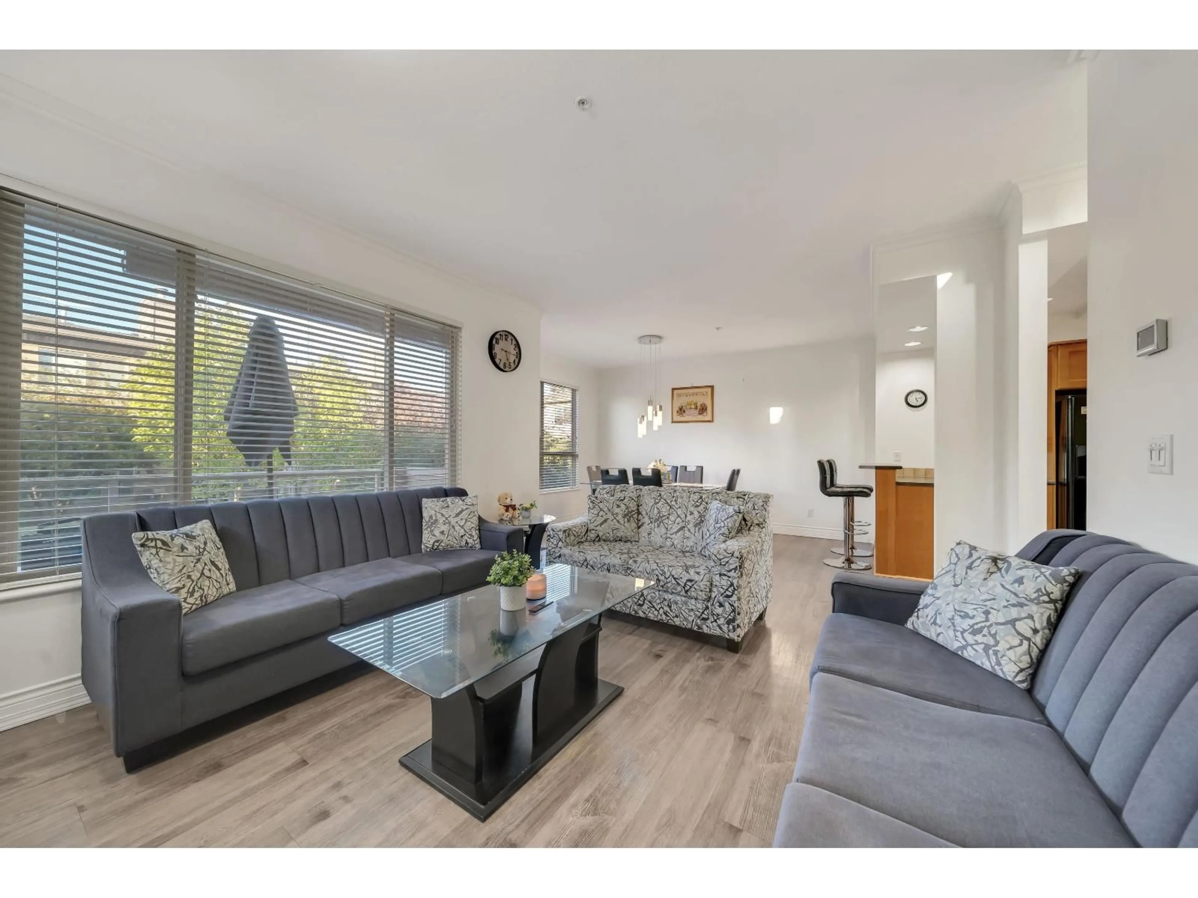 Living room with furniture, wood/laminate floor for 14 - 16655 64, Surrey British Columbia V3S3V1