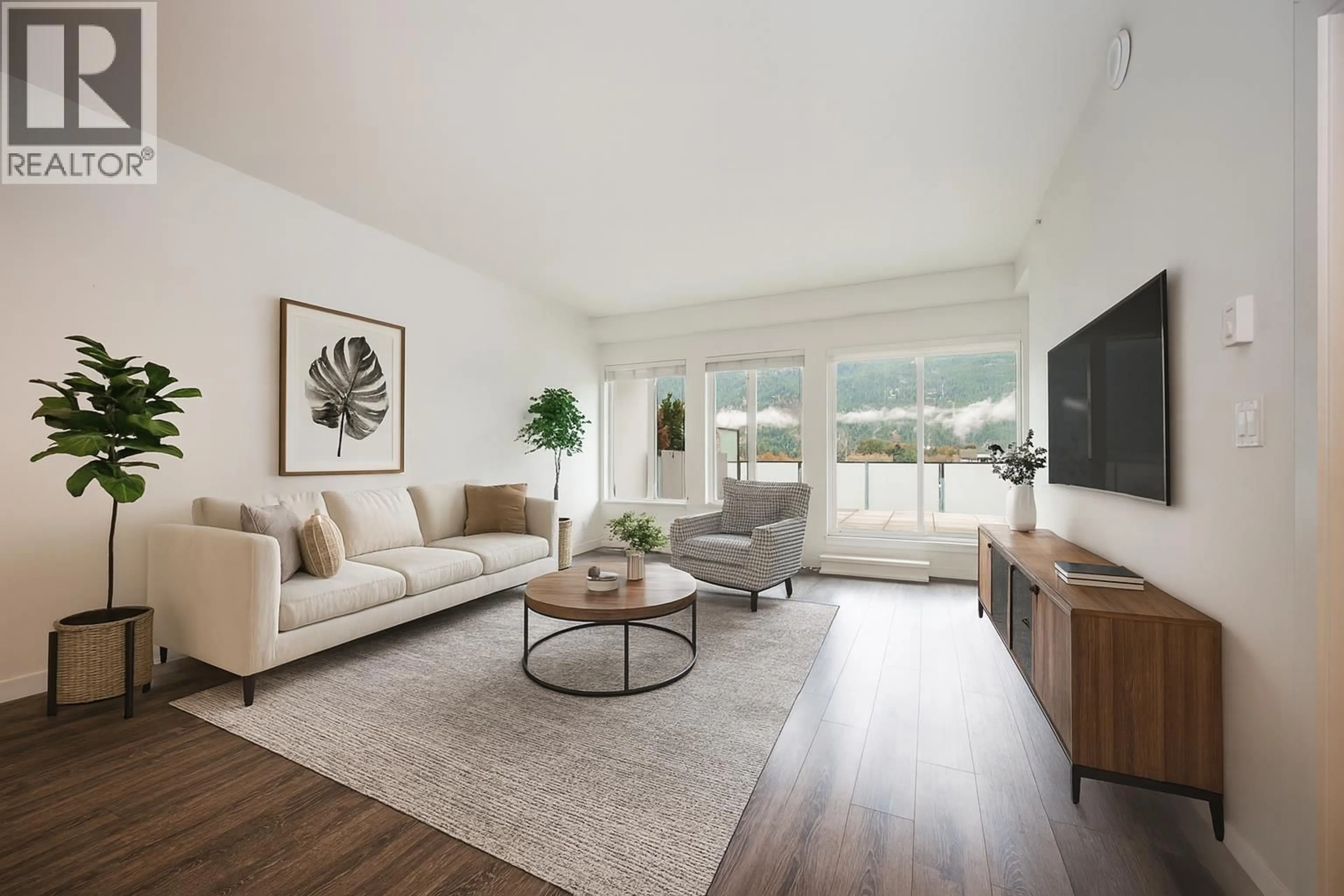 Living room with furniture, wood/laminate floor for 603 - 1365 PEMBERTON AVENUE, Squamish British Columbia V8B1B7