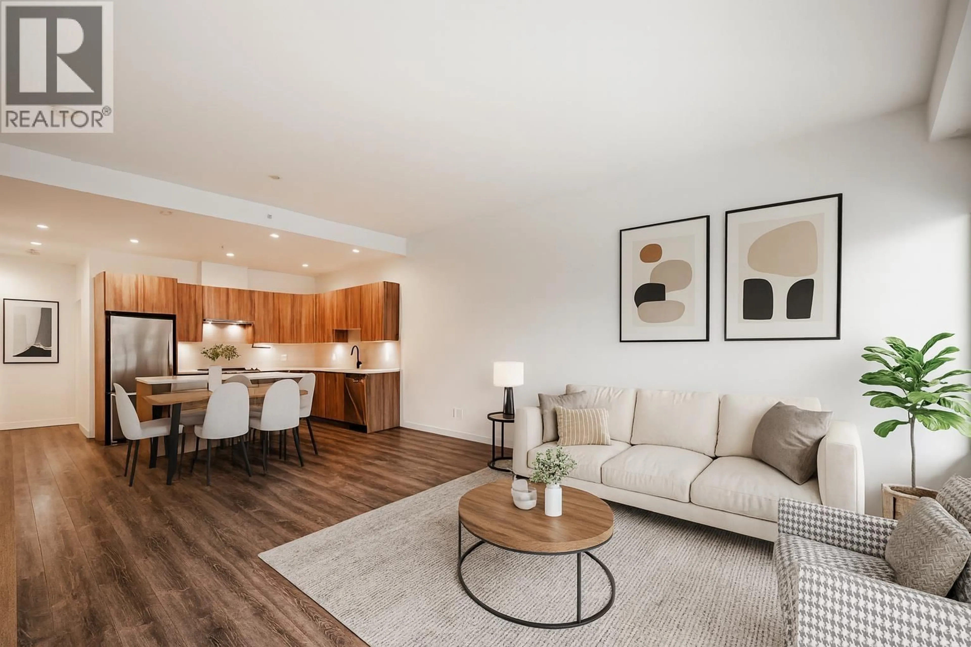 Living room with furniture, wood/laminate floor for 603 - 1365 PEMBERTON AVENUE, Squamish British Columbia V8B1B7