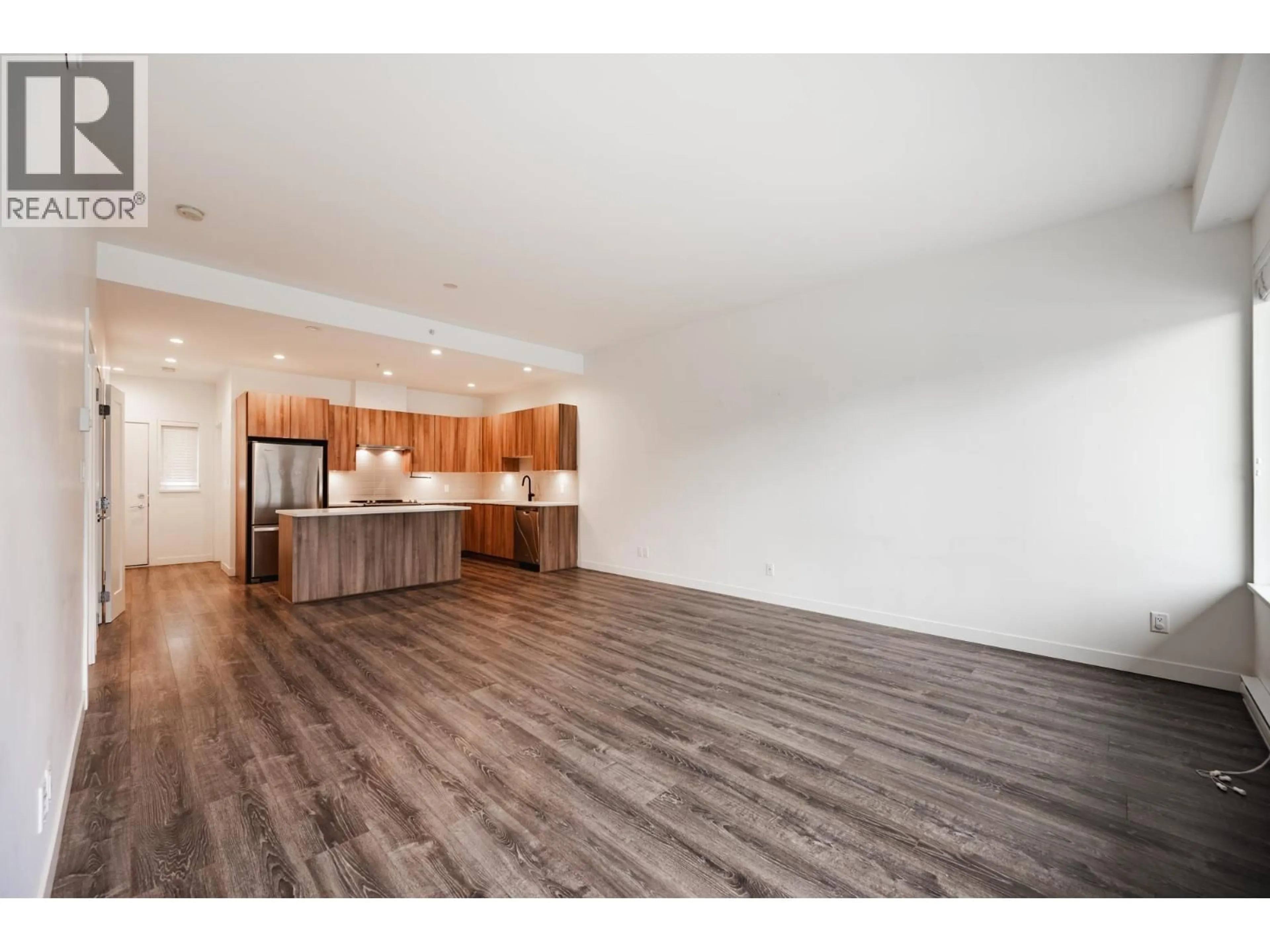Open concept kitchen, wood/laminate floor for 603 - 1365 PEMBERTON AVENUE, Squamish British Columbia V8B1B7