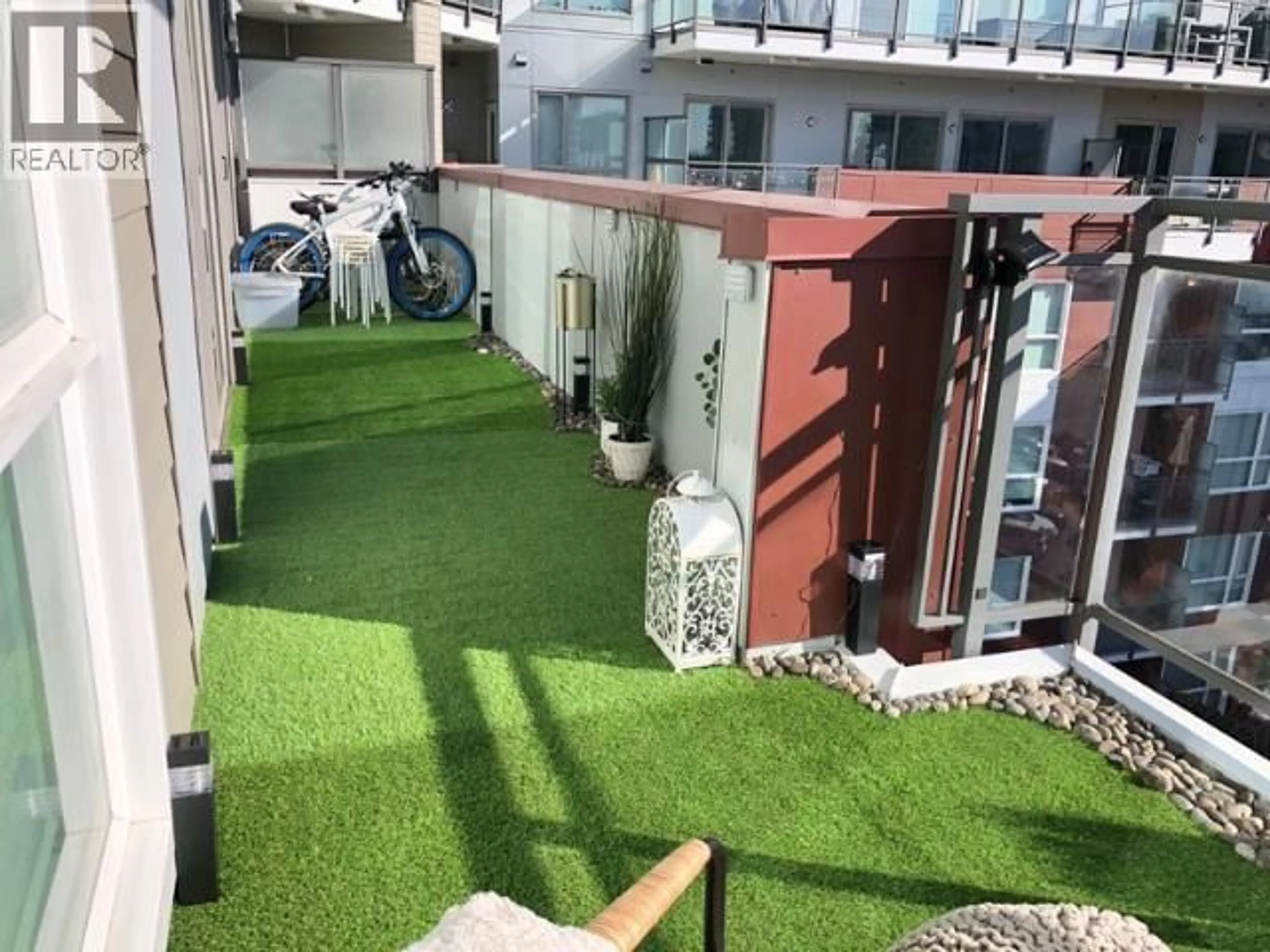 Patio, city buildings view from balcony for 602 - 5399 CEDARBRIDGE WAY, Richmond British Columbia V6X0L6