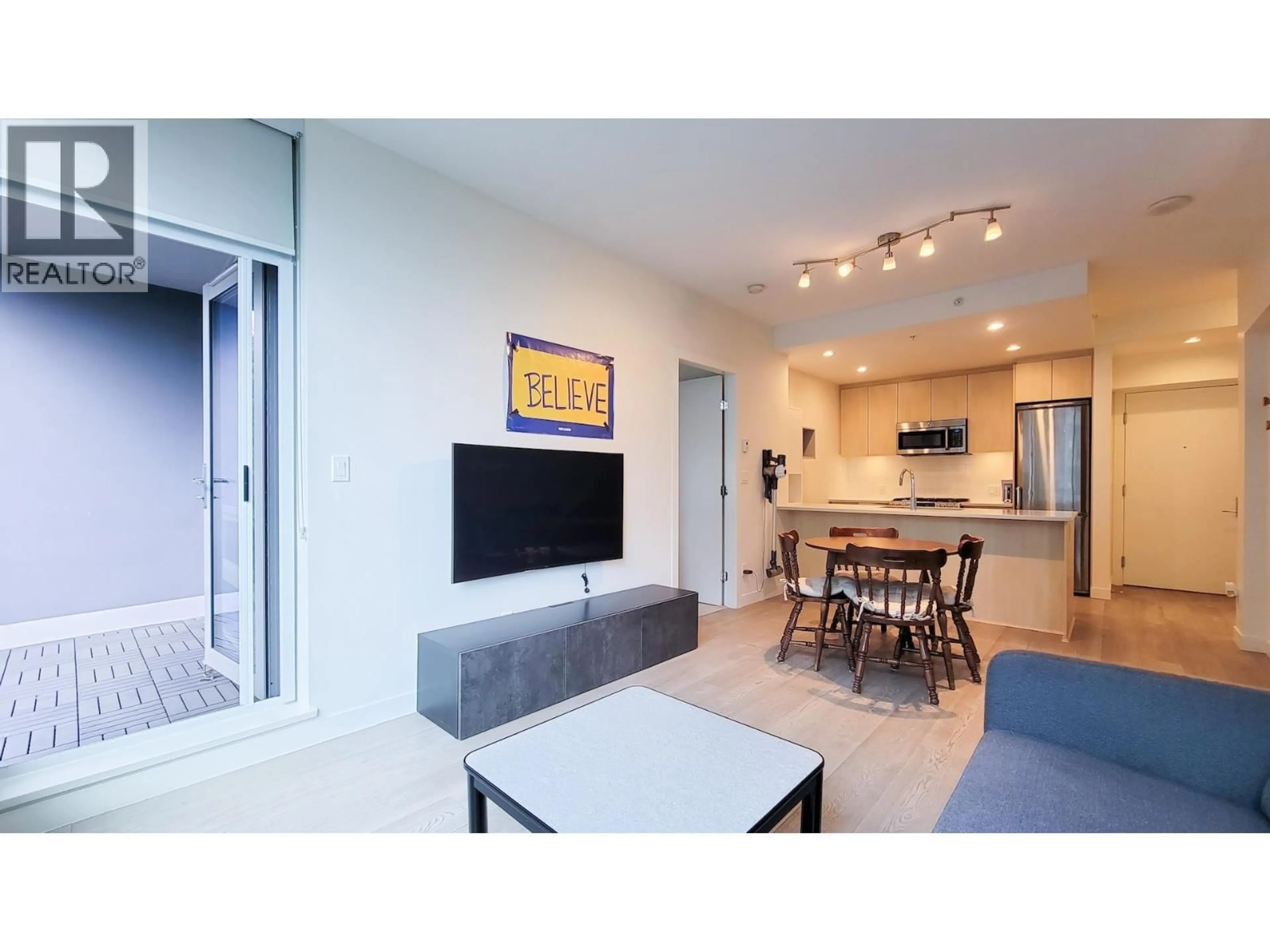 Living room with furniture, unknown for 706 - 9080 UNIVERSITY CRESCENT, Burnaby British Columbia V5A0B7