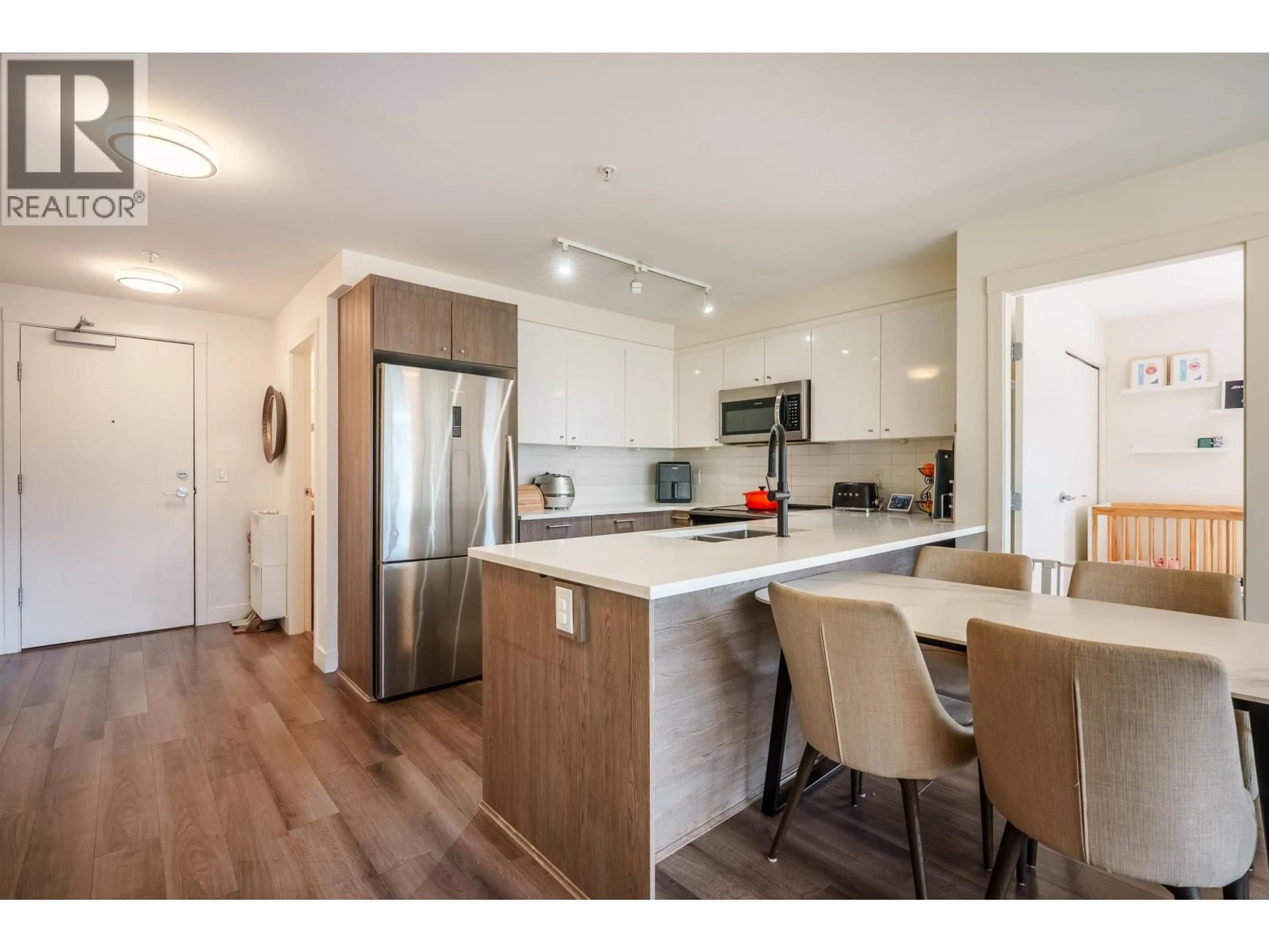 Open concept kitchen, wood/laminate floor for 418 - 2525 CLARKE STREET, Port Moody British Columbia V3H0J3