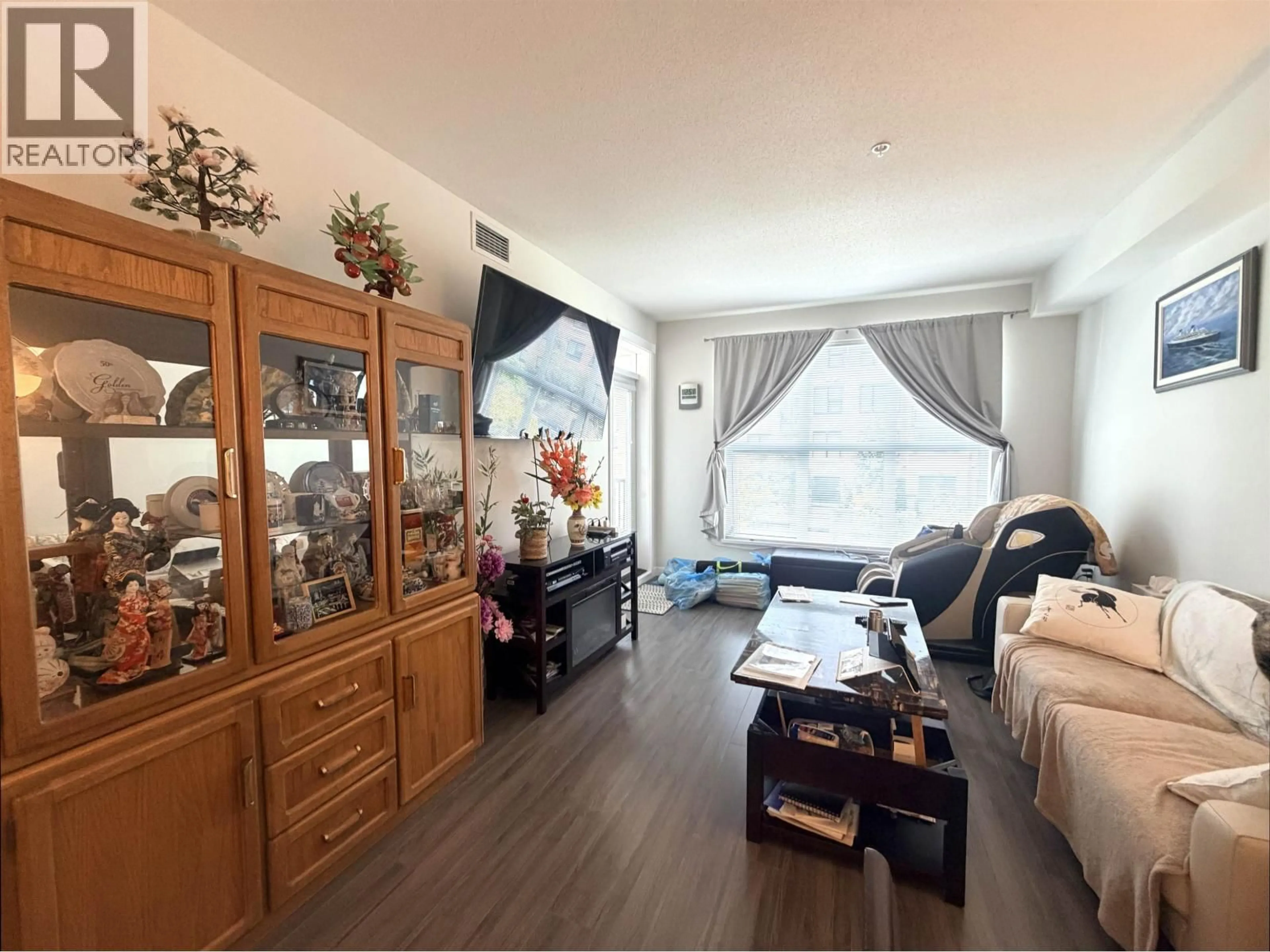 Living room with furniture, wood/laminate floor for 227 - 9500 TOMICKI AVENUE, Richmond British Columbia V6X0R9