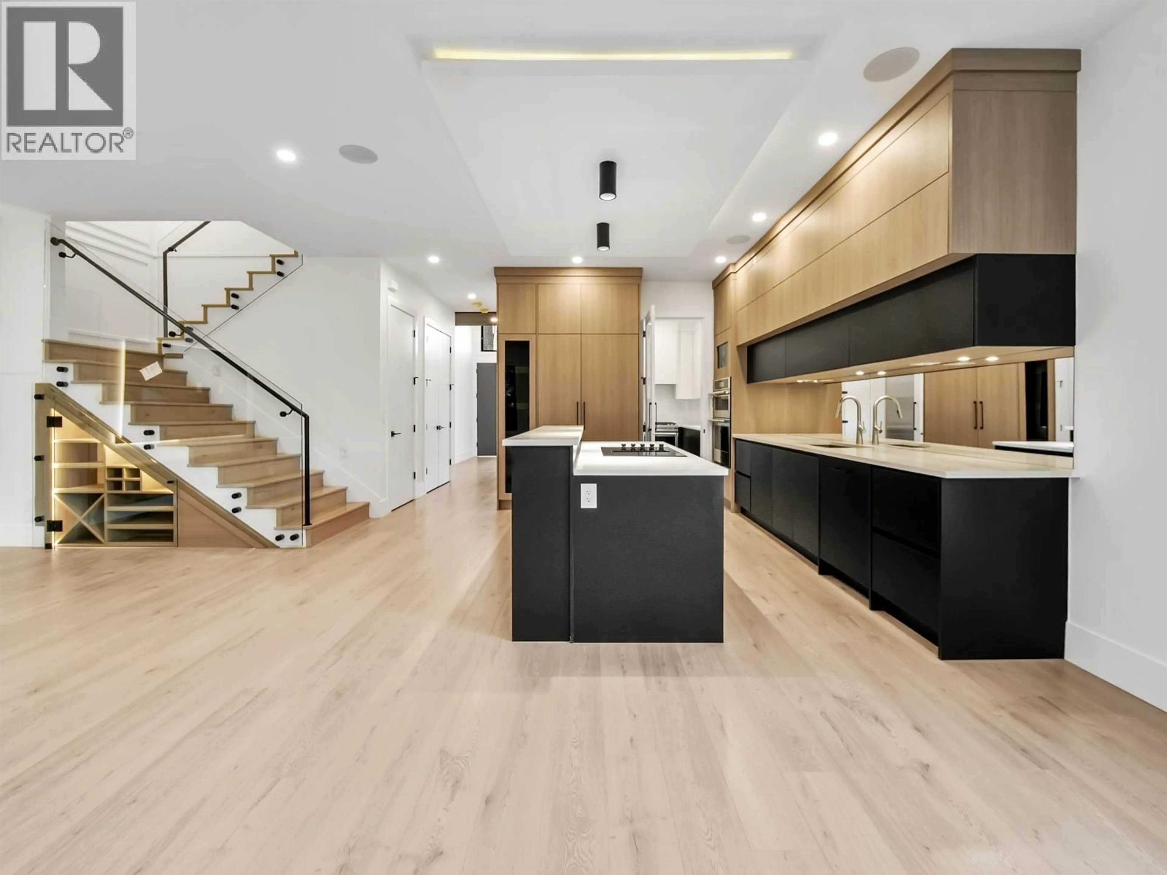 Open concept kitchen, wood/laminate floor for 6079 44A AVENUE, Ladner British Columbia V4K4C8