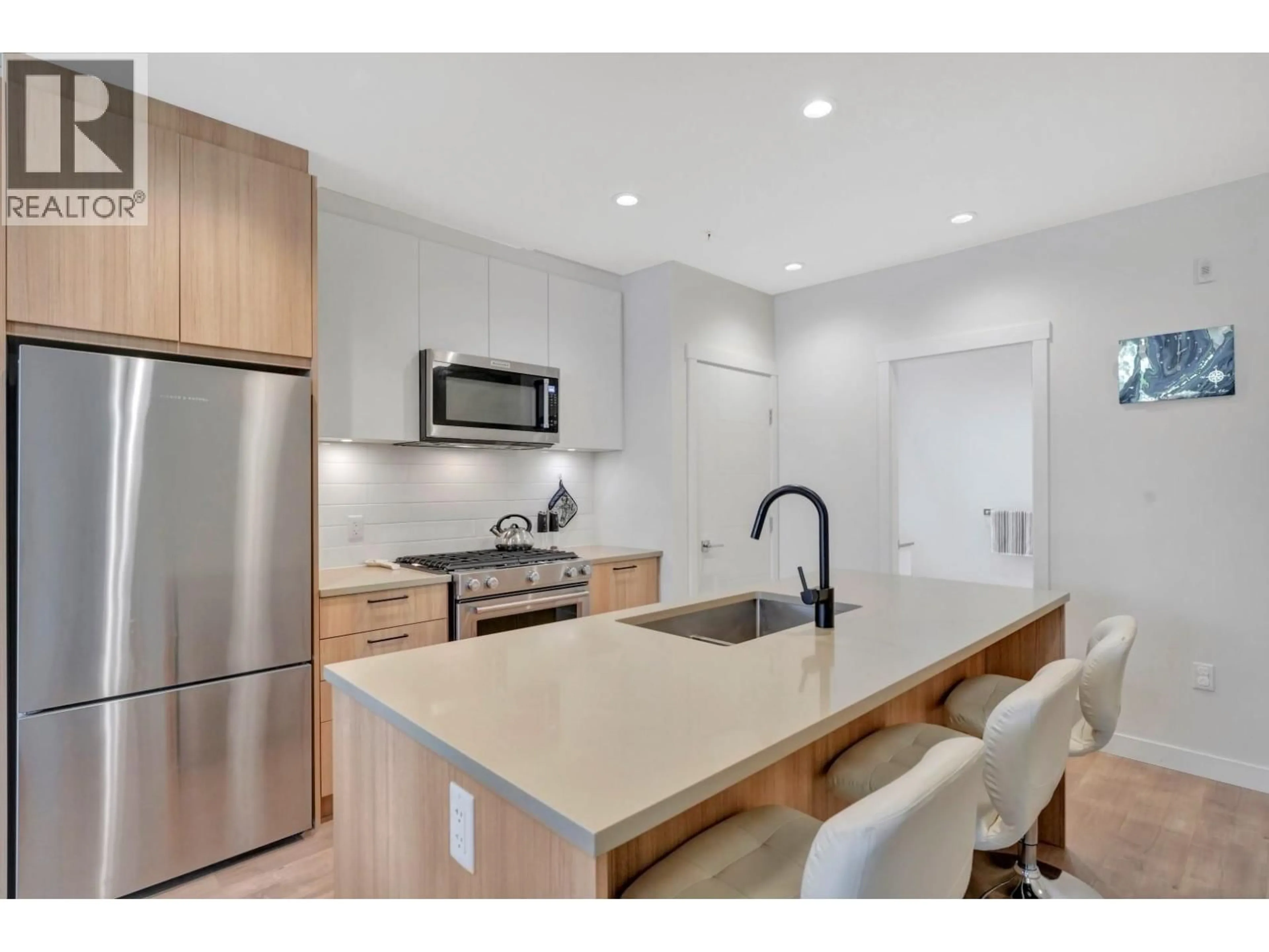 Open concept kitchen, unknown for 311 - 707 COMO LAKE AVENUE, Coquitlam British Columbia V3J0J5