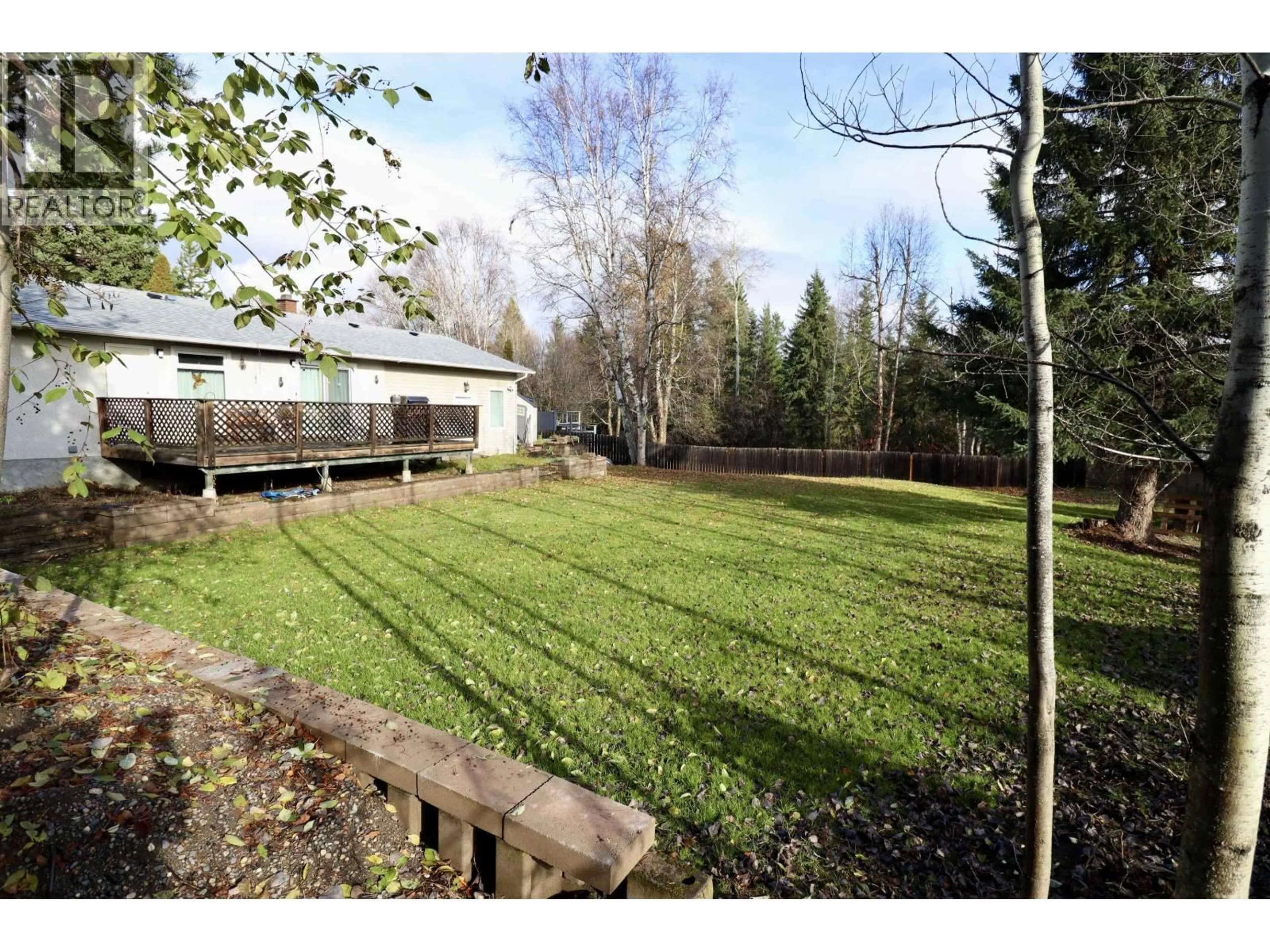 A pic from outside/outdoor area/front of a property/back of a property/a pic from drone, forest/trees view for 7129 HARTFORD CRESCENT, Prince George British Columbia V2N2W2
