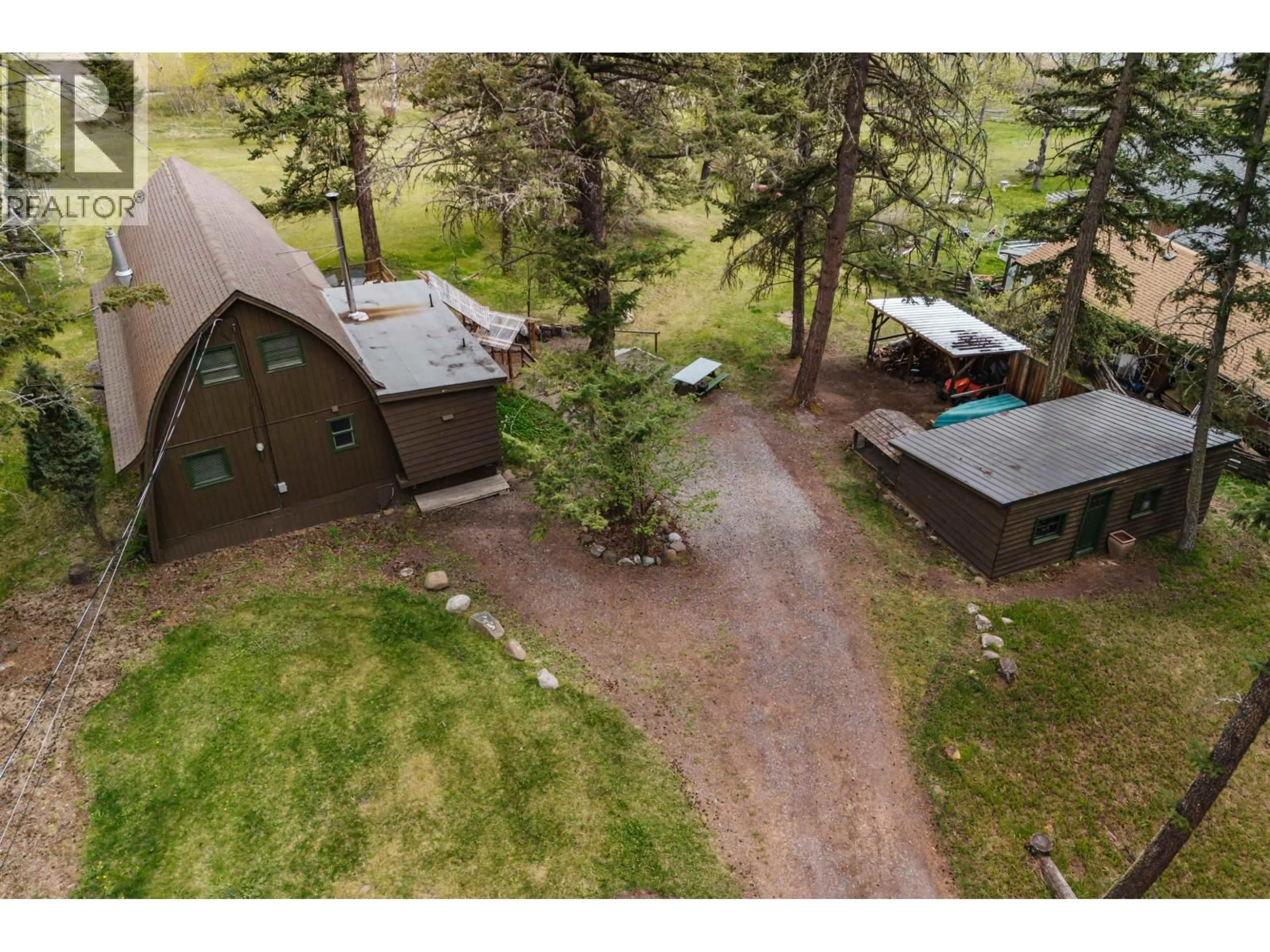 A pic from outside/outdoor area/front of a property/back of a property/a pic from drone, mountain view for 5359 ANNAHAM CRESCENT, 108 Mile Ranch British Columbia V0K2Z0