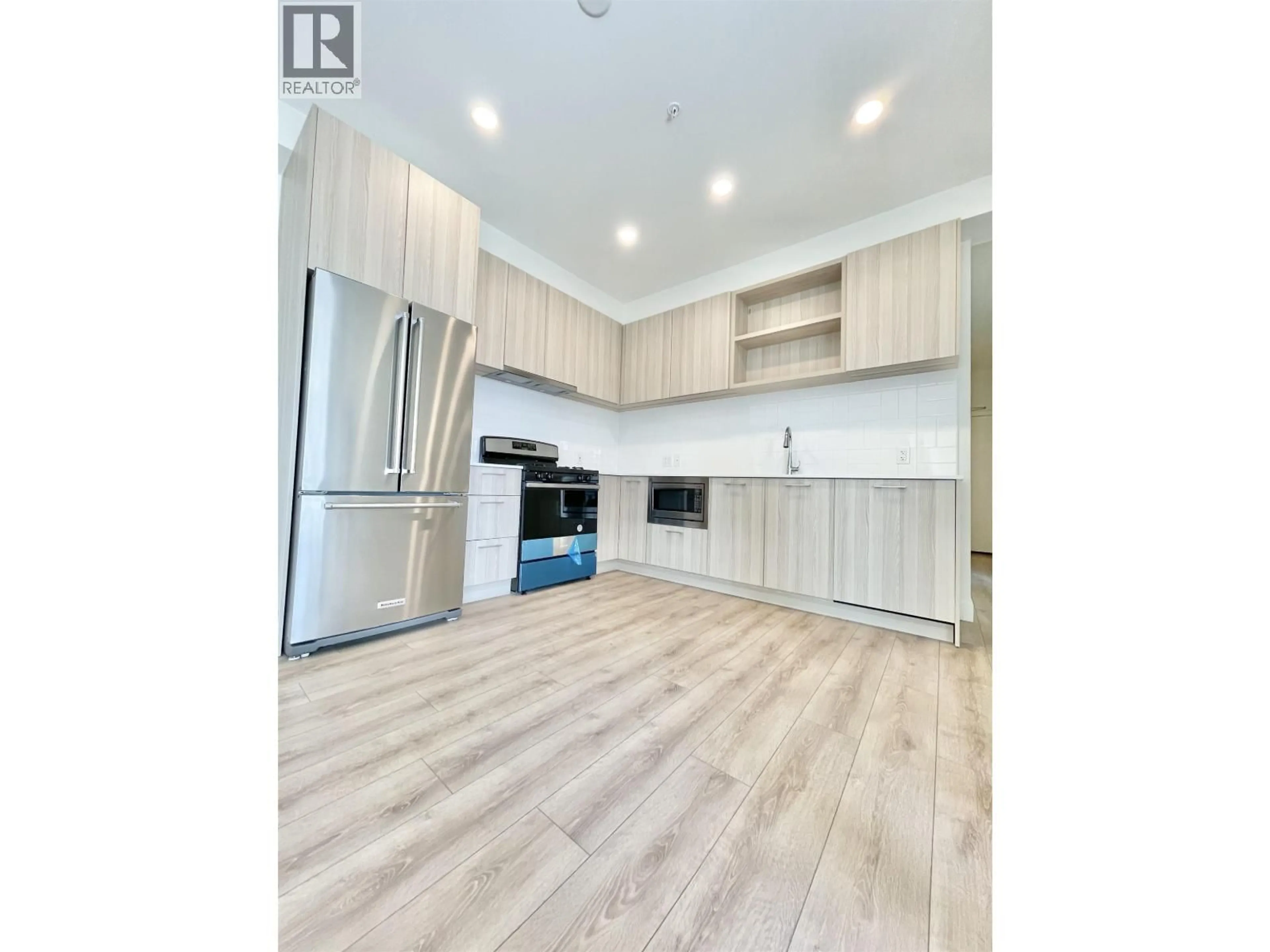 Open concept kitchen, wood/laminate floor for 601 - 741 ANSKAR COURT, Coquitlam British Columbia V3J0N3