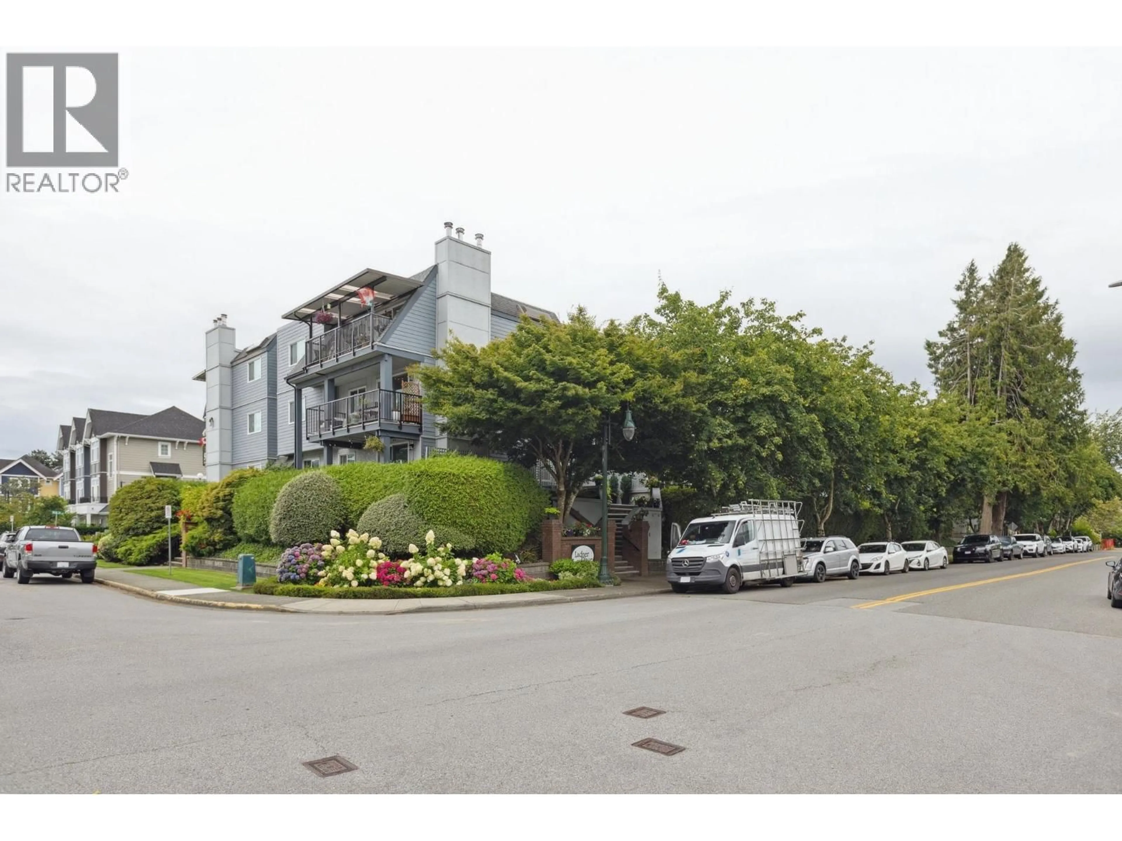 A pic from outside/outdoor area/front of a property/back of a property/a pic from drone, street for 110 - 4926 48 AVENUE, Ladner British Columbia V4K1V3
