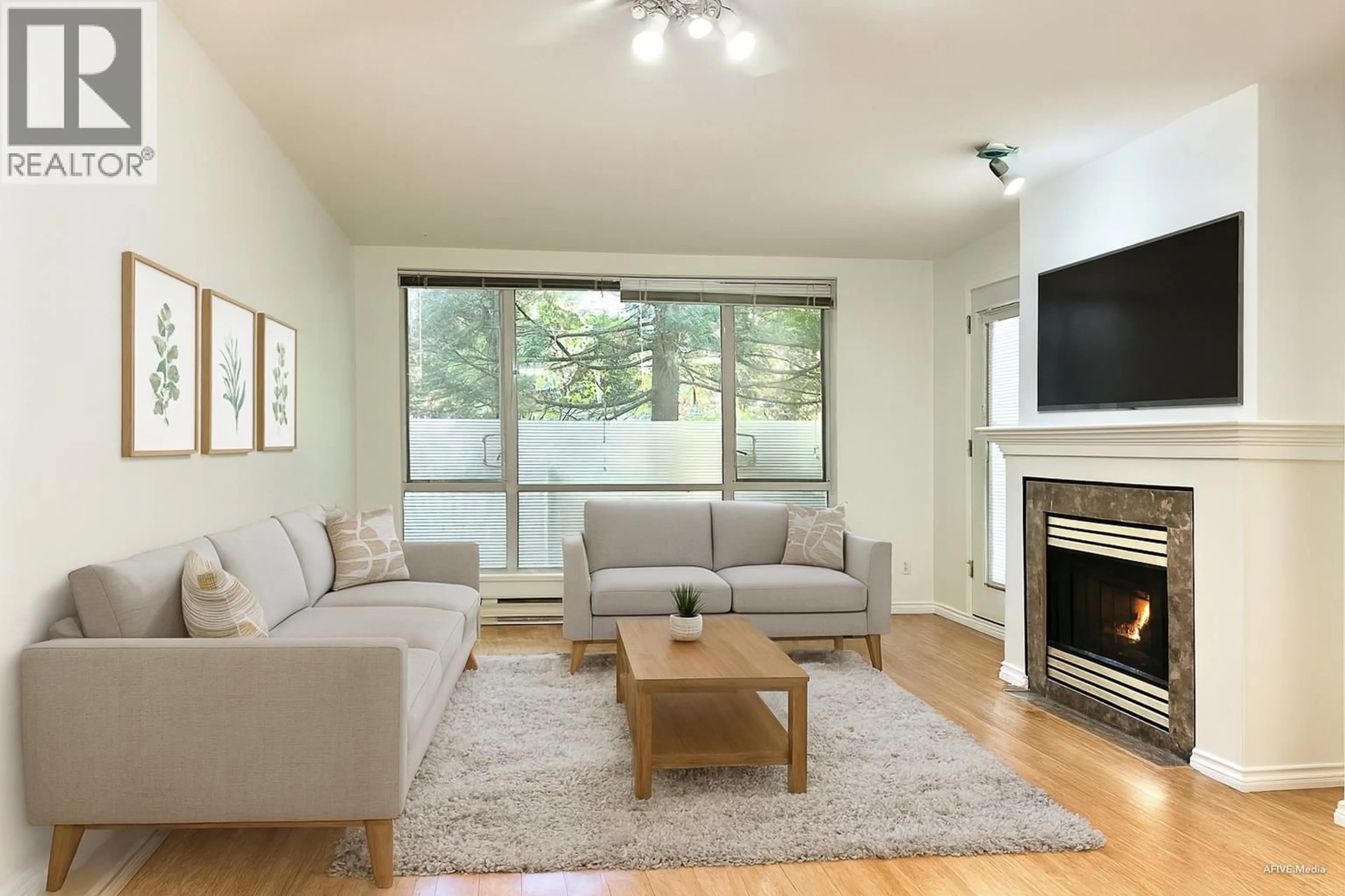 Living room with furniture, wood/laminate floor for 205 - 6742 STATION HILL COURT, Burnaby British Columbia V3N4V2