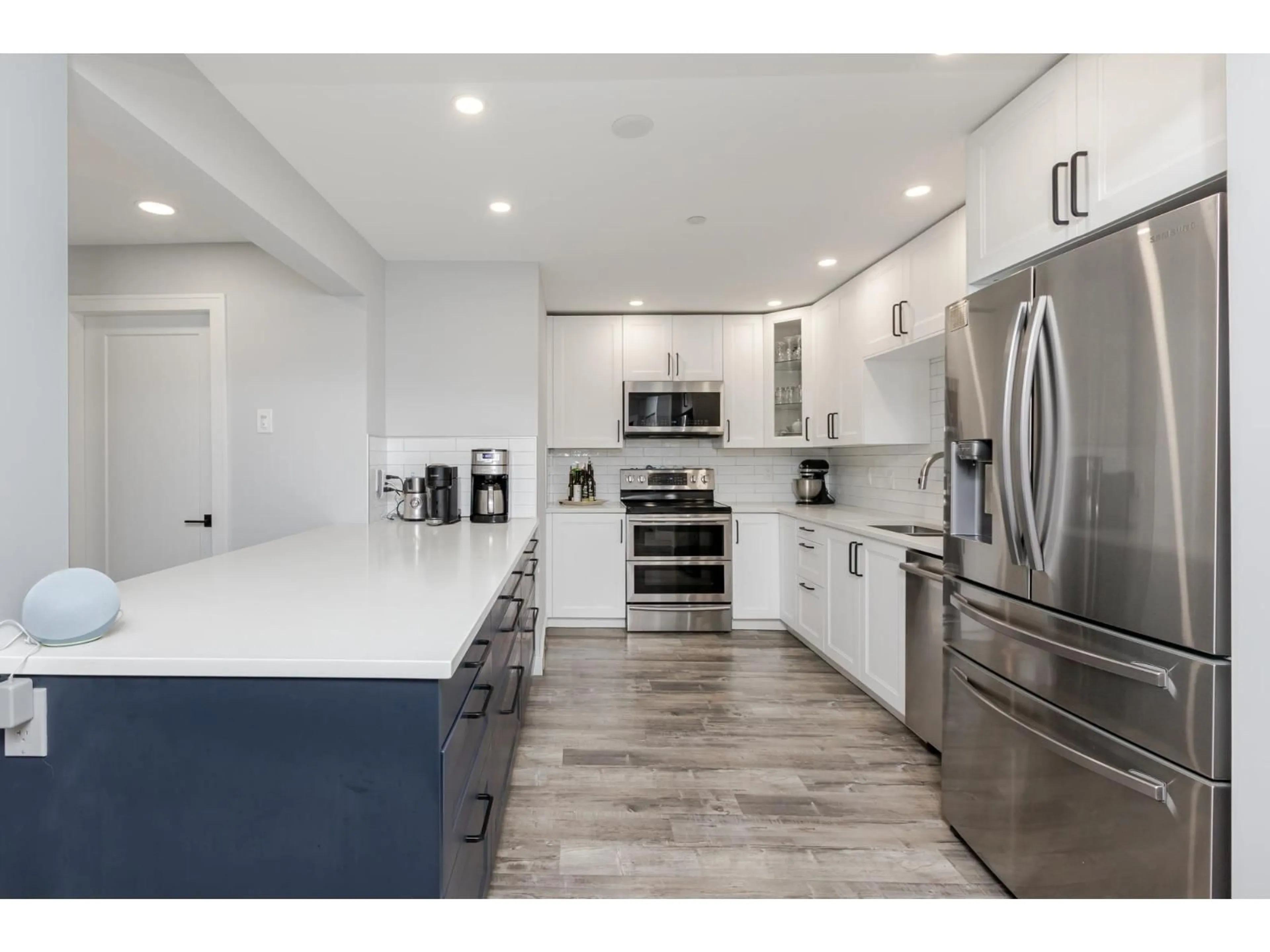 Open concept kitchen, ceramic/tile floor for 102 - 20894 57, Langley British Columbia V3A8M7
