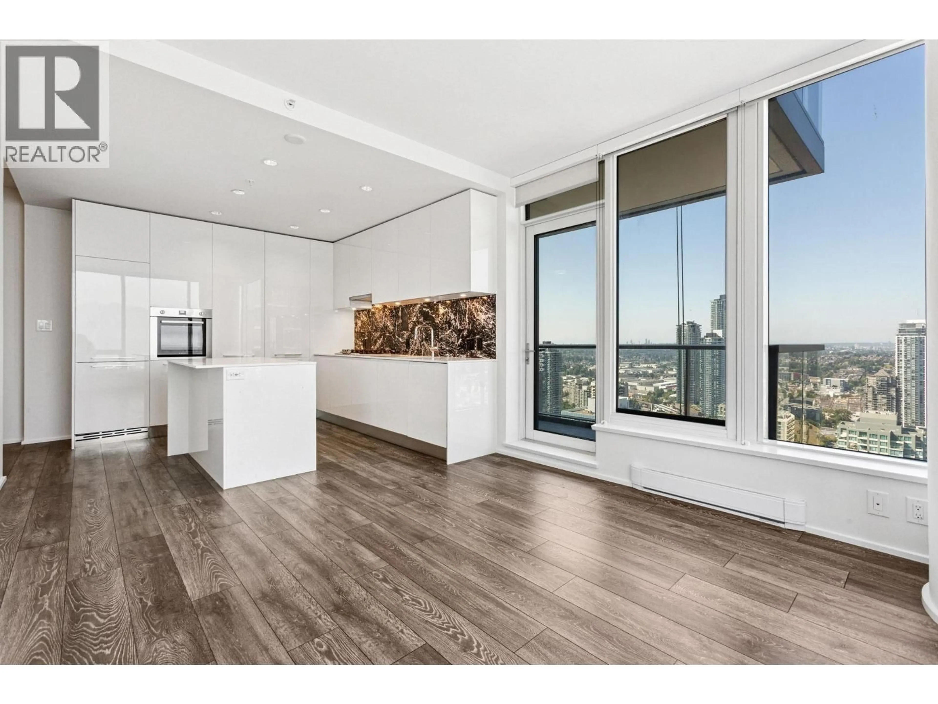 Open concept kitchen, wood/laminate floor for 3711 - 4510 HALIFAX WAY, Burnaby British Columbia V5C0K4