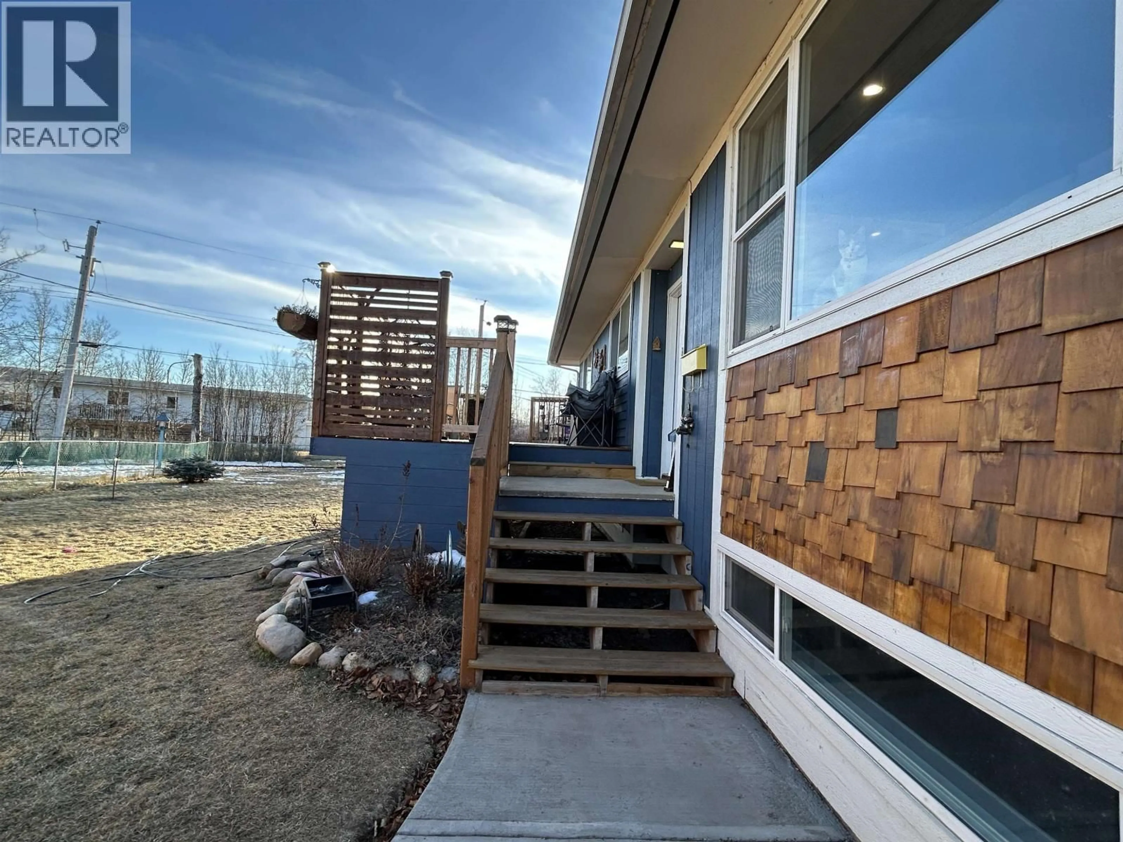 Home with vinyl exterior material, building for 10204 TURNER CRESCENT, Hudsons Hope British Columbia V0C1V0