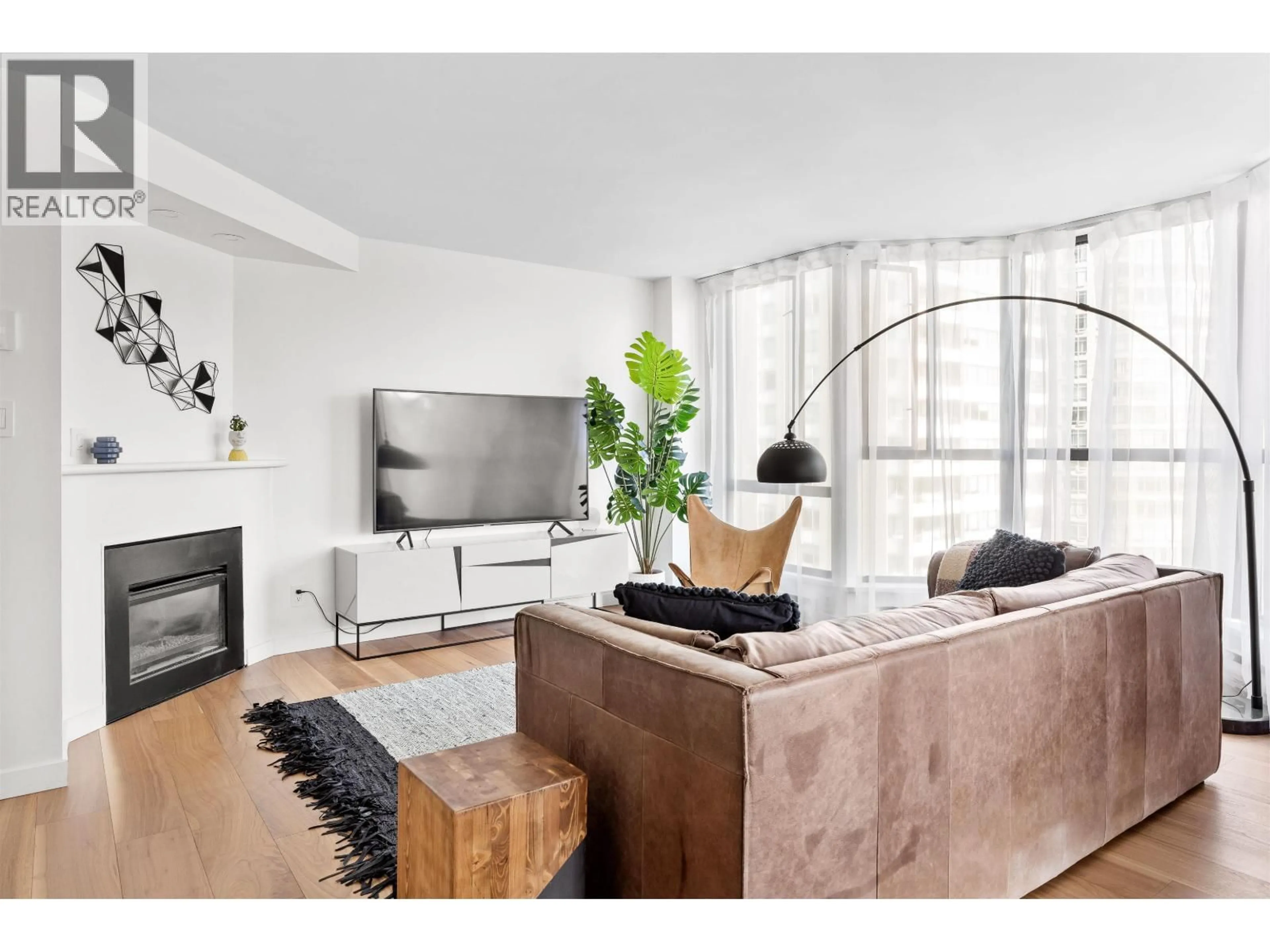 Living room with furniture, wood/laminate floor for 903 - 789 JERVIS STREET, Vancouver British Columbia V6E2B1