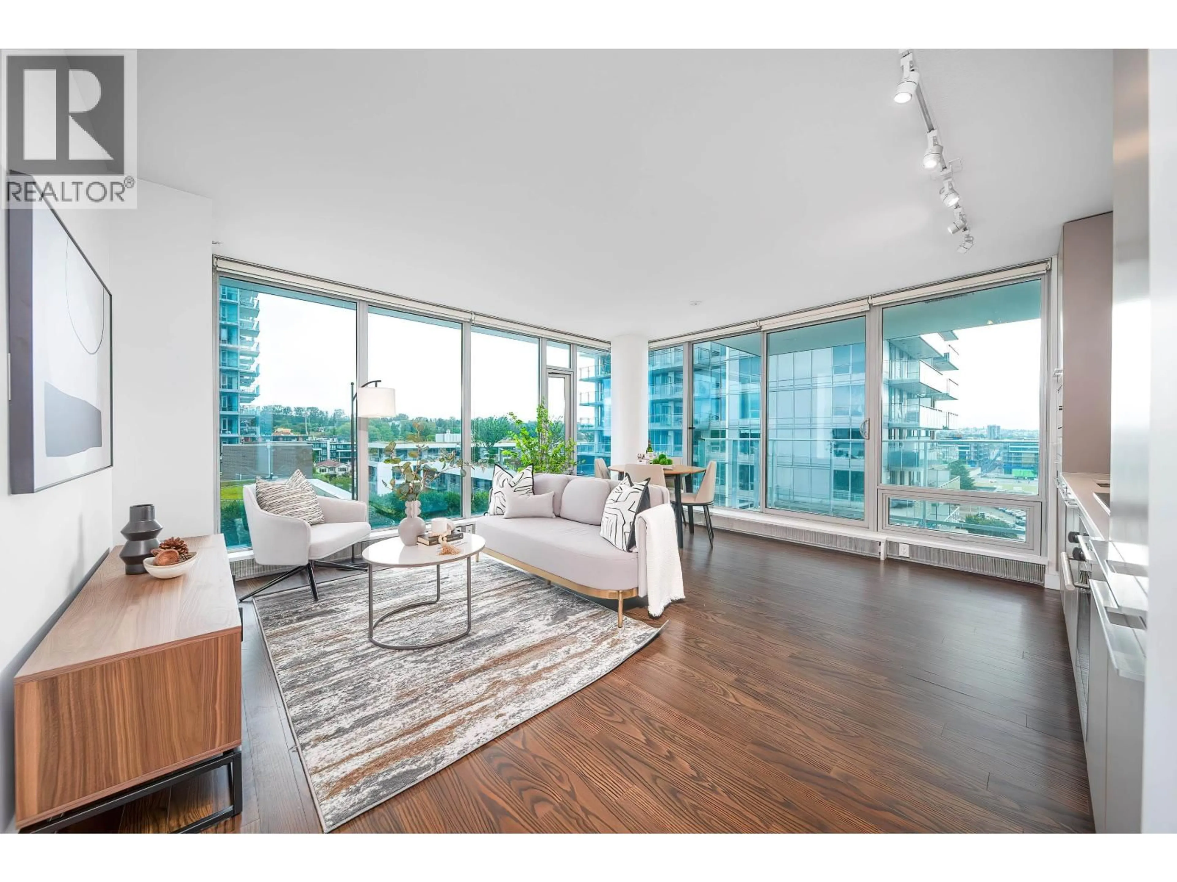 Living room with furniture, wood/laminate floor for 904 - 8131 NUNAVUT LANE, Vancouver British Columbia V5X0E2