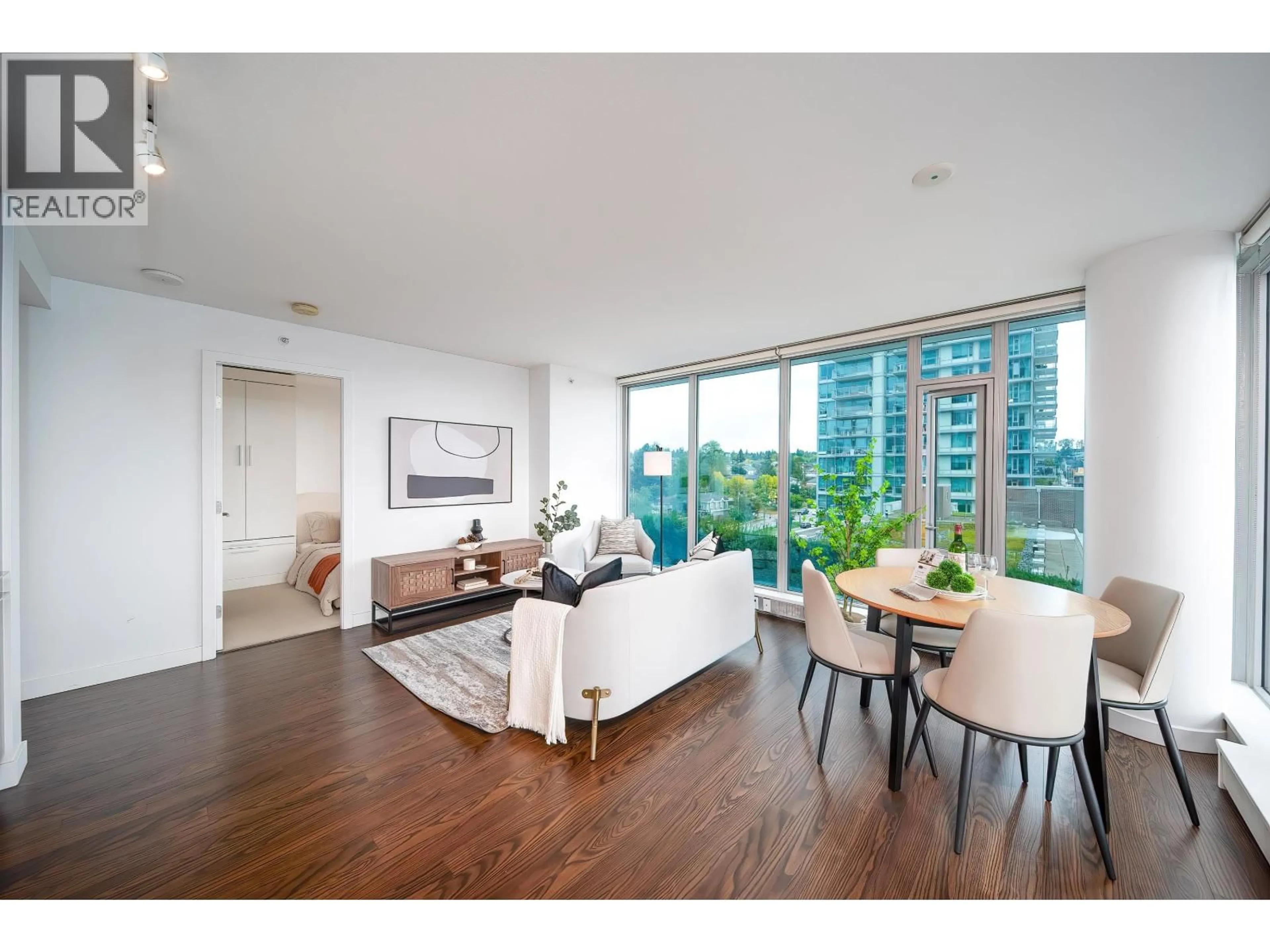 Living room with furniture, wood/laminate floor for 904 - 8131 NUNAVUT LANE, Vancouver British Columbia V5X0E2