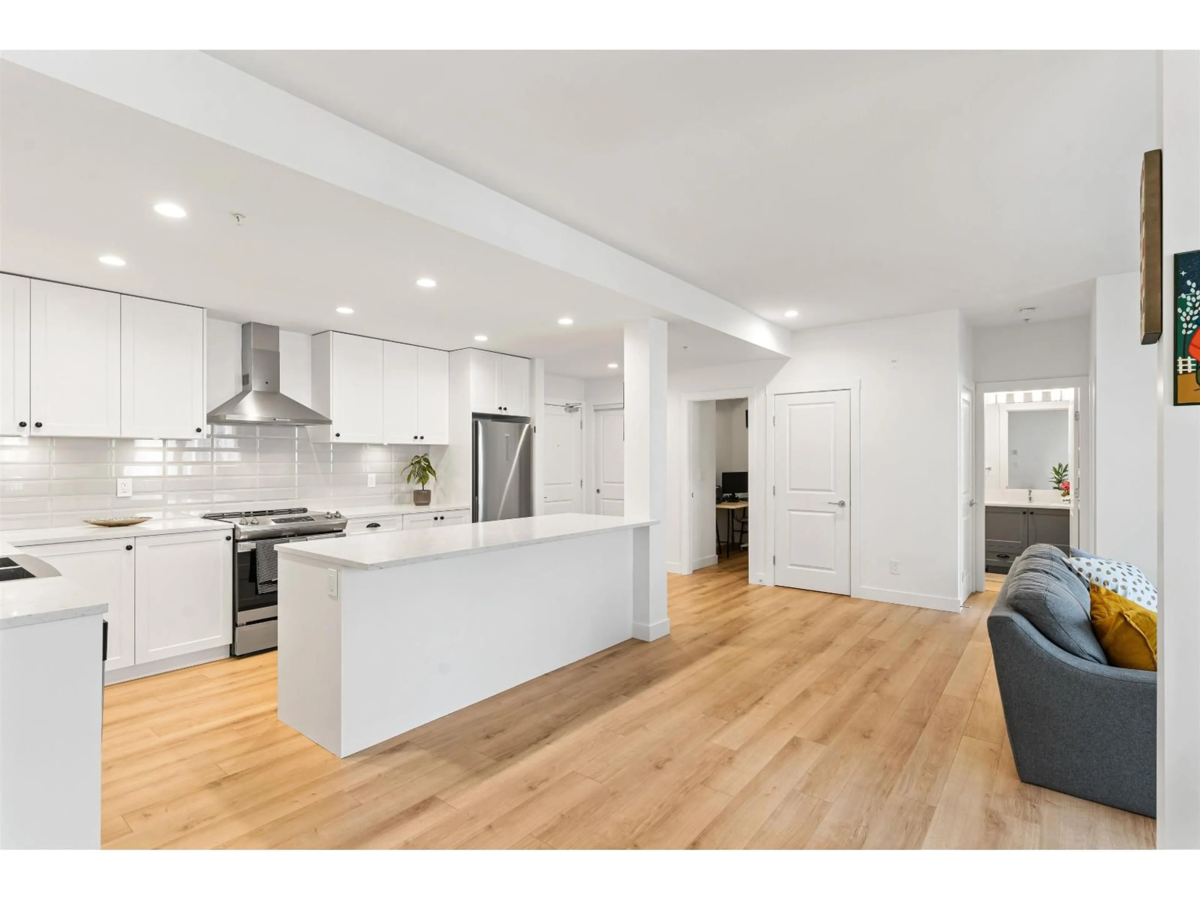 Open concept kitchen, wood/laminate floor for A213 - 20487 65, Langley British Columbia V2Y3K5