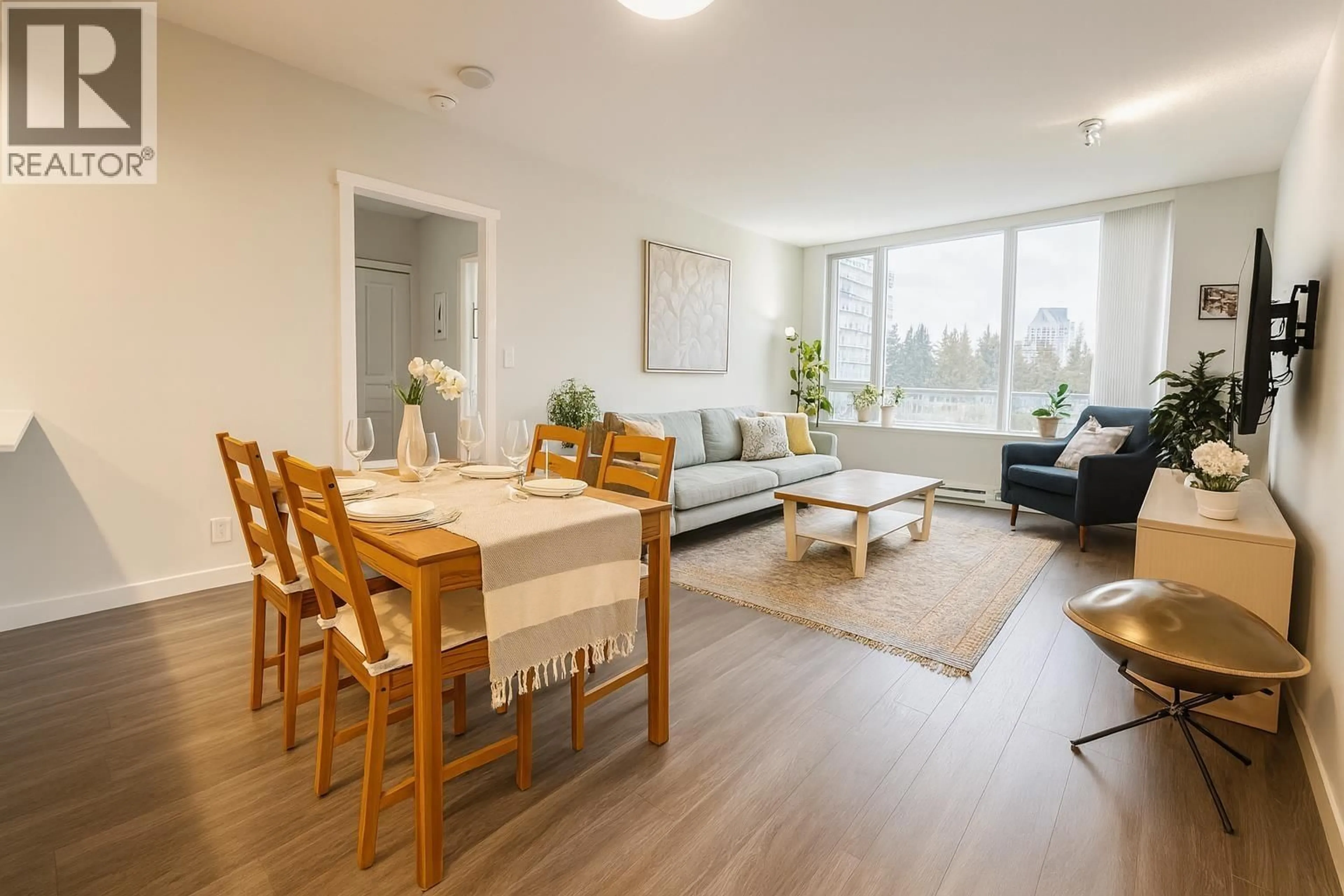 Living room with furniture, wood/laminate floor for 706 - 3100 WINDSOR GATE, Coquitlam British Columbia V3B0P3