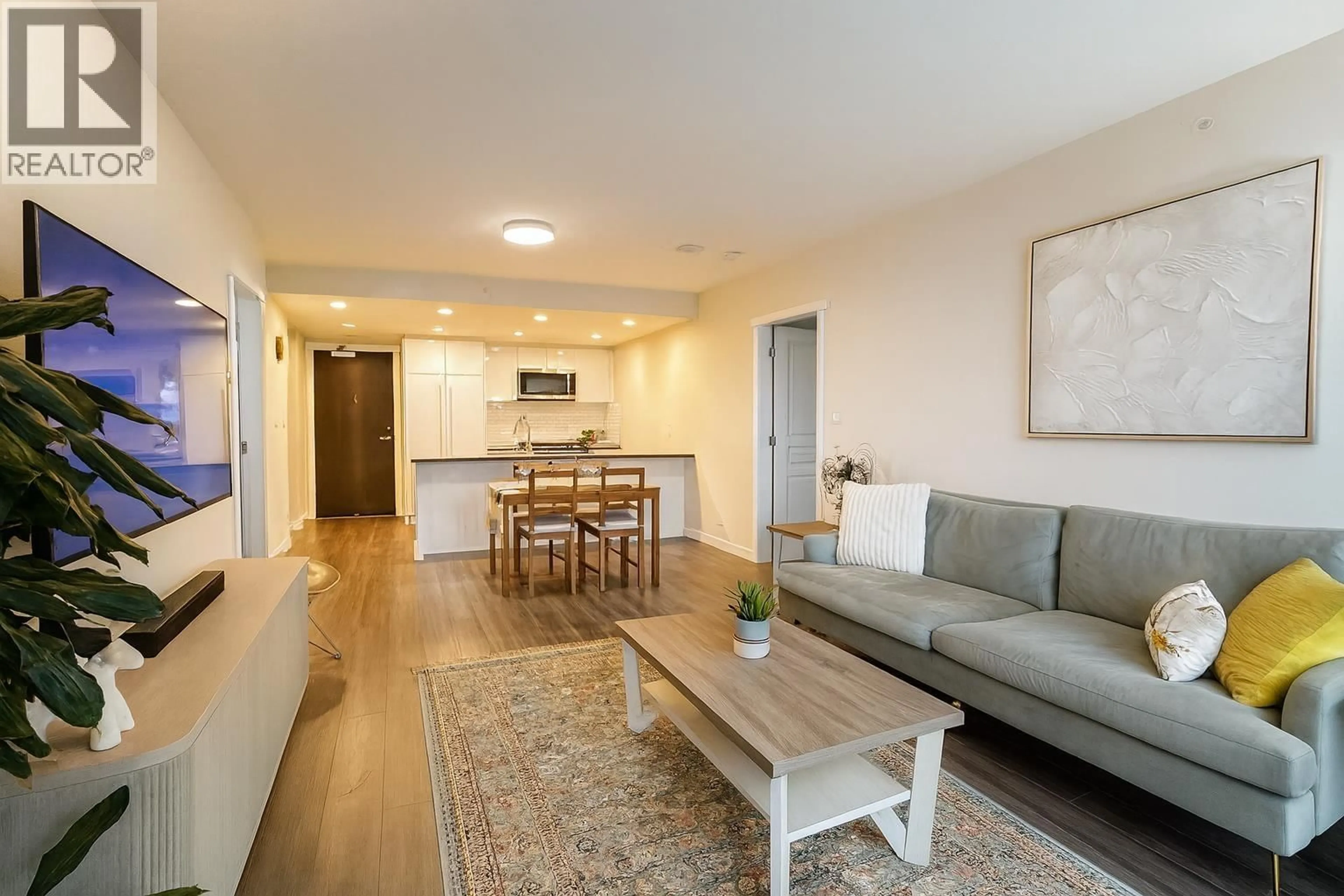Living room with furniture, wood/laminate floor for 706 - 3100 WINDSOR GATE, Coquitlam British Columbia V3B0P3