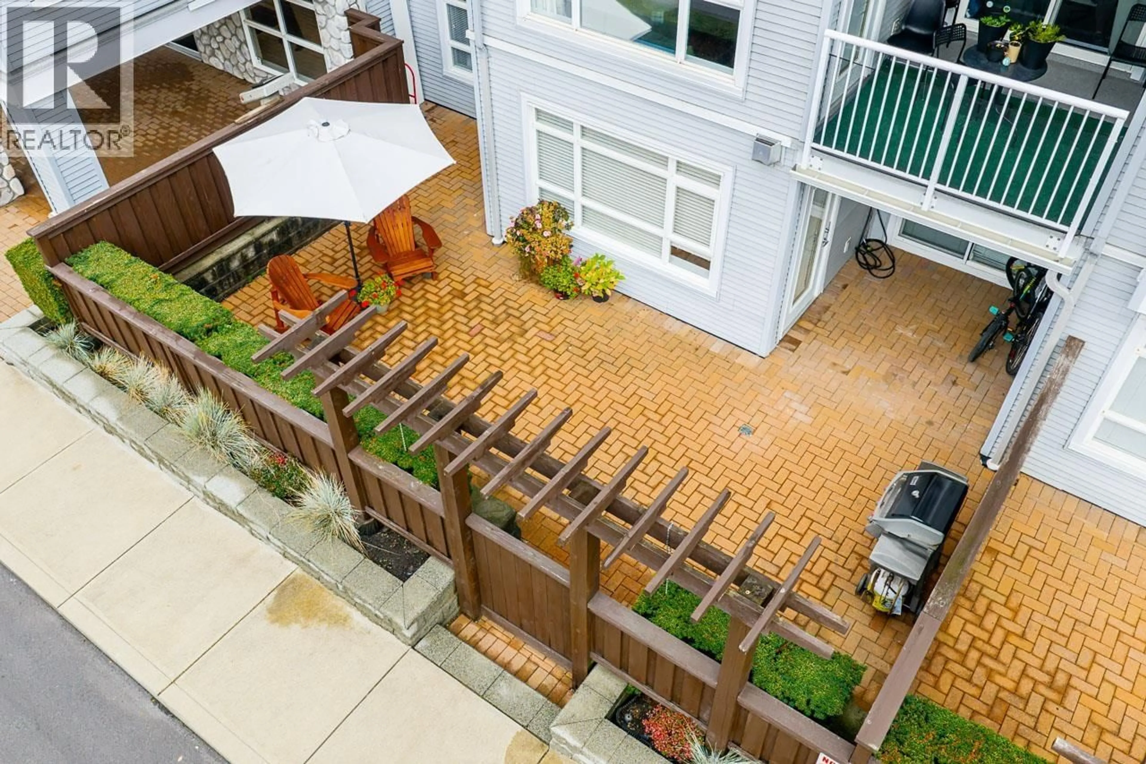 Patio, city buildings view from balcony for 103 - 3142 ST JOHNS STREET, Port Moody British Columbia V3H5E5