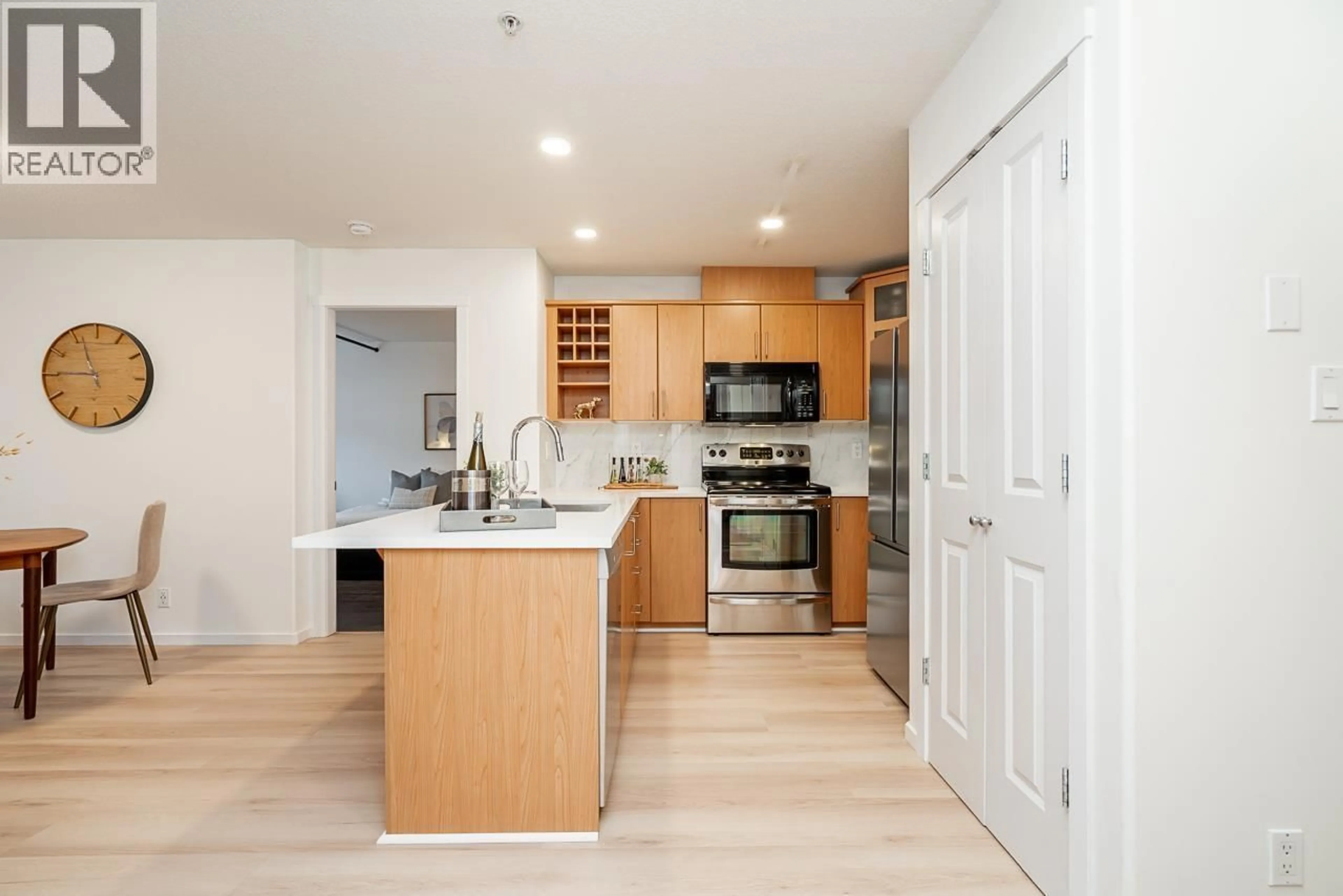 Open concept kitchen, wood/laminate floor for 103 - 3142 ST JOHNS STREET, Port Moody British Columbia V3H5E5