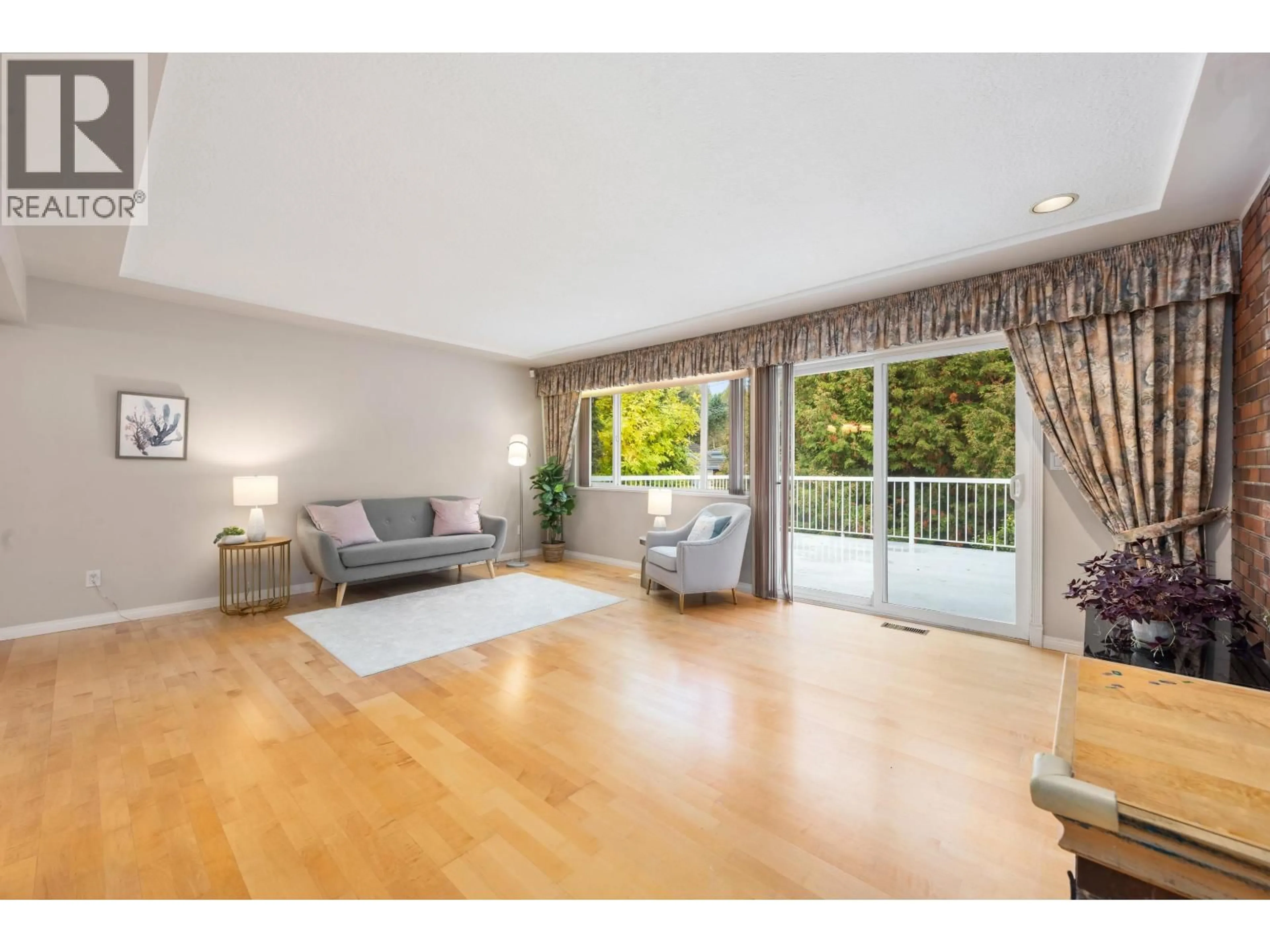 Living room with furniture, wood/laminate floor for 8080 MINLER ROAD, Richmond British Columbia V7C3T7