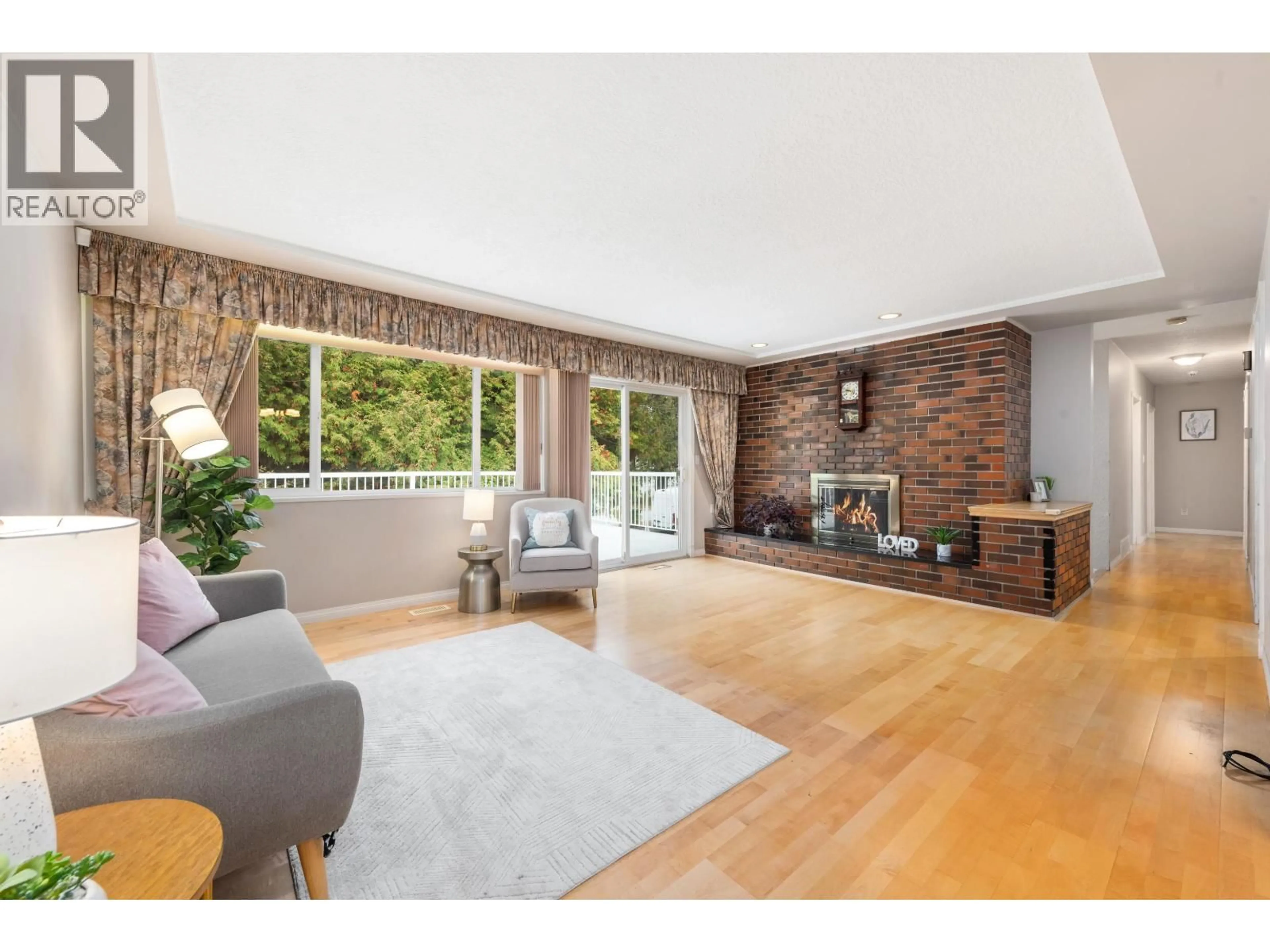Living room with furniture, wood/laminate floor for 8080 MINLER ROAD, Richmond British Columbia V7C3T7
