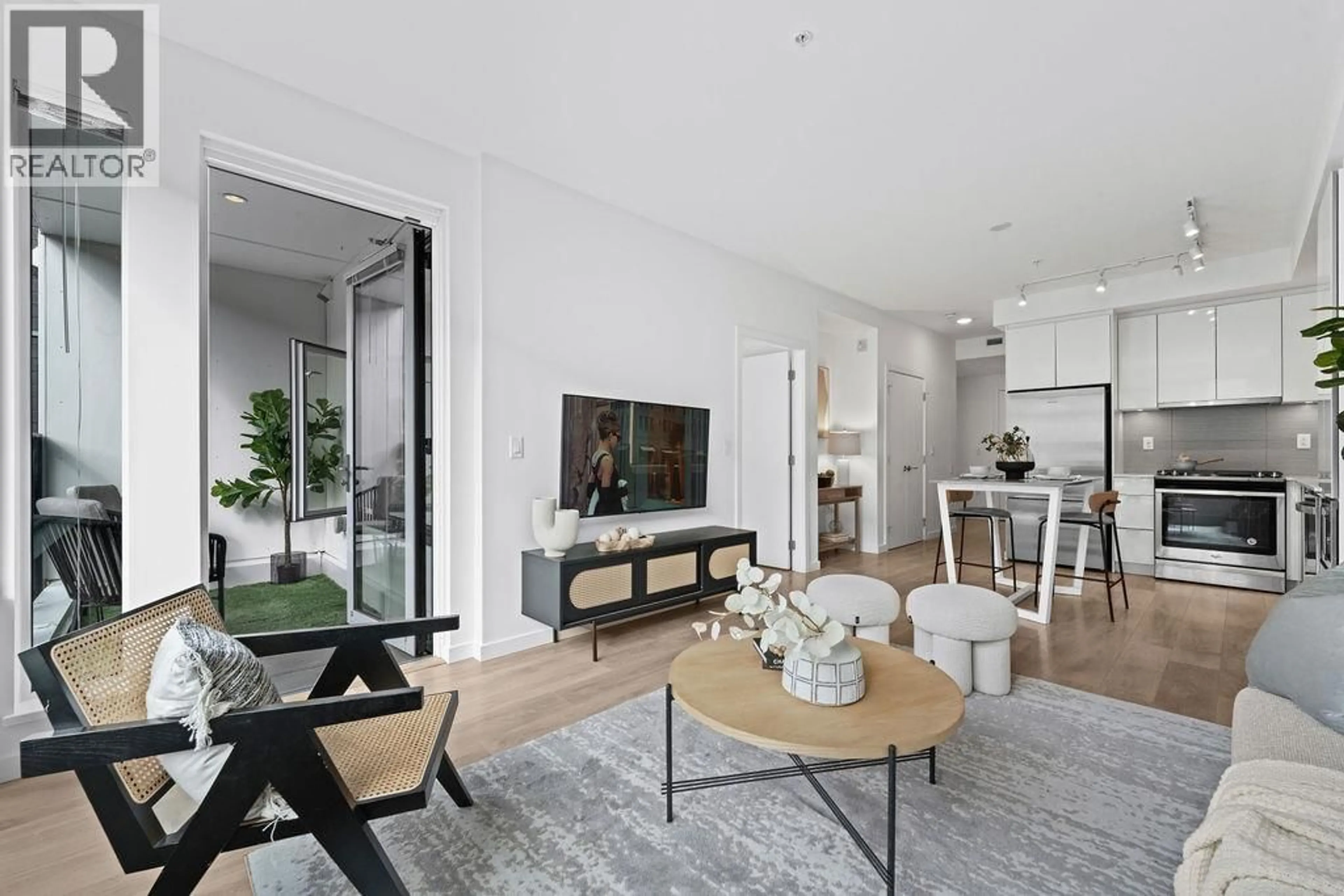 Living room with furniture, unknown for 206 - 725 MARINE DRIVE, North Vancouver British Columbia V7M0G2