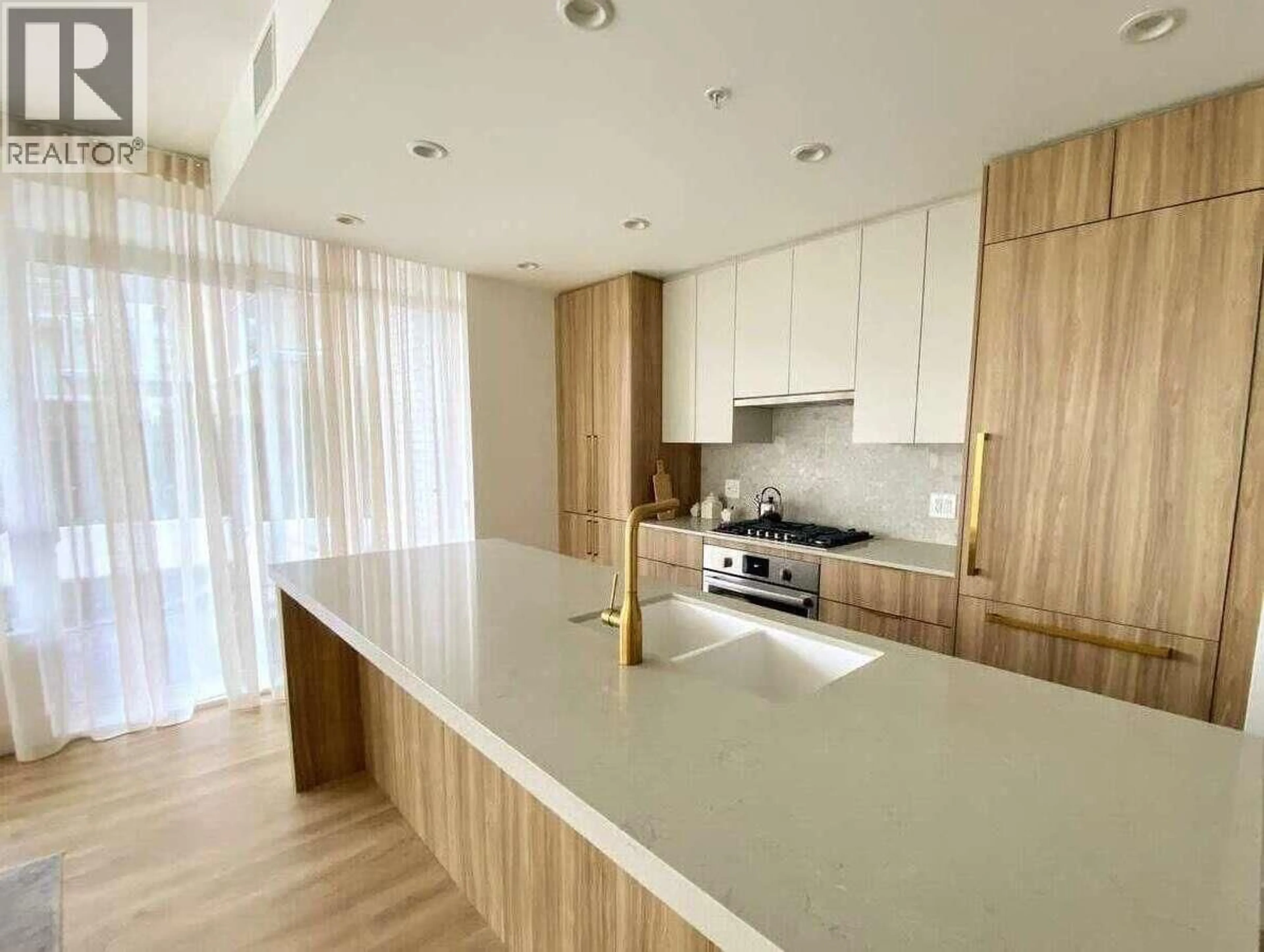 Open concept kitchen, wood/laminate floor for 103 - 2375 EMERY COURT, North Vancouver British Columbia V7J0E8