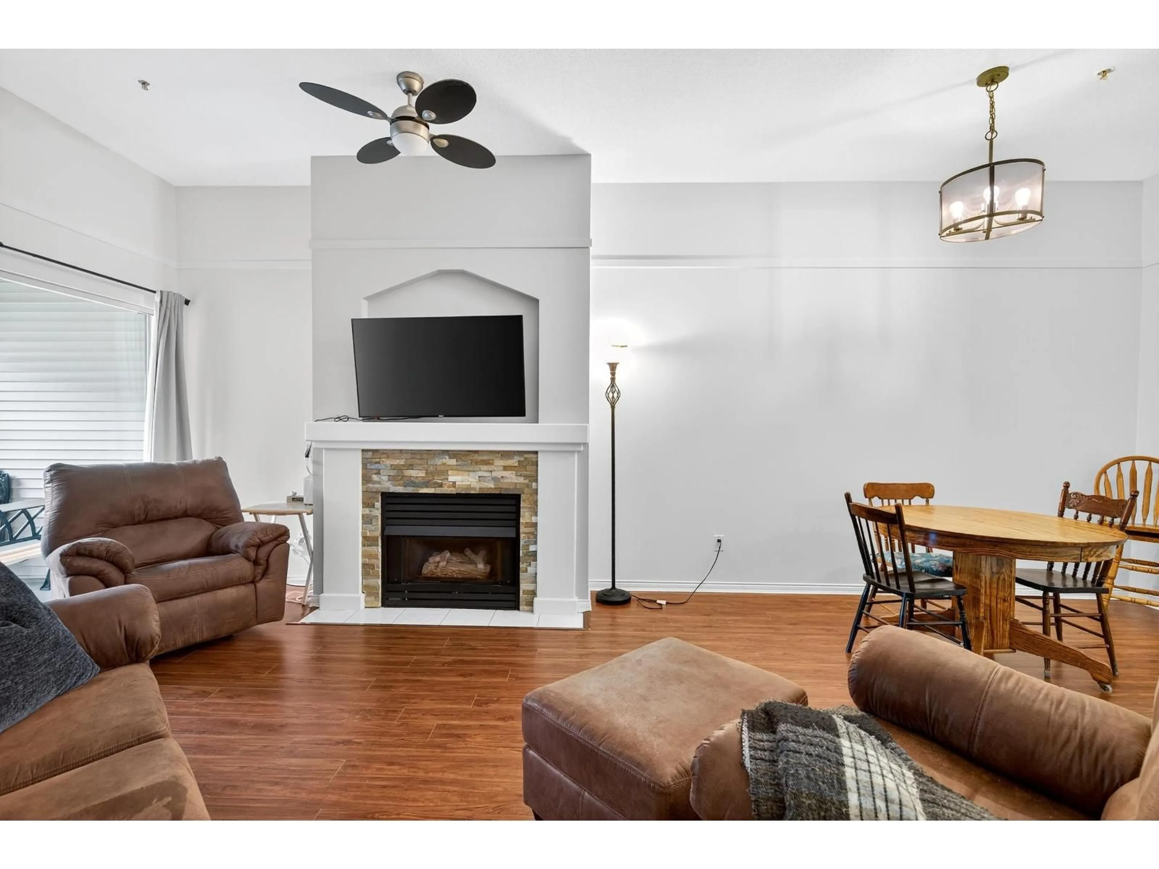 Living room with furniture, wood/laminate floor for 322 - 19528 FRASER, Surrey British Columbia V3S8P4