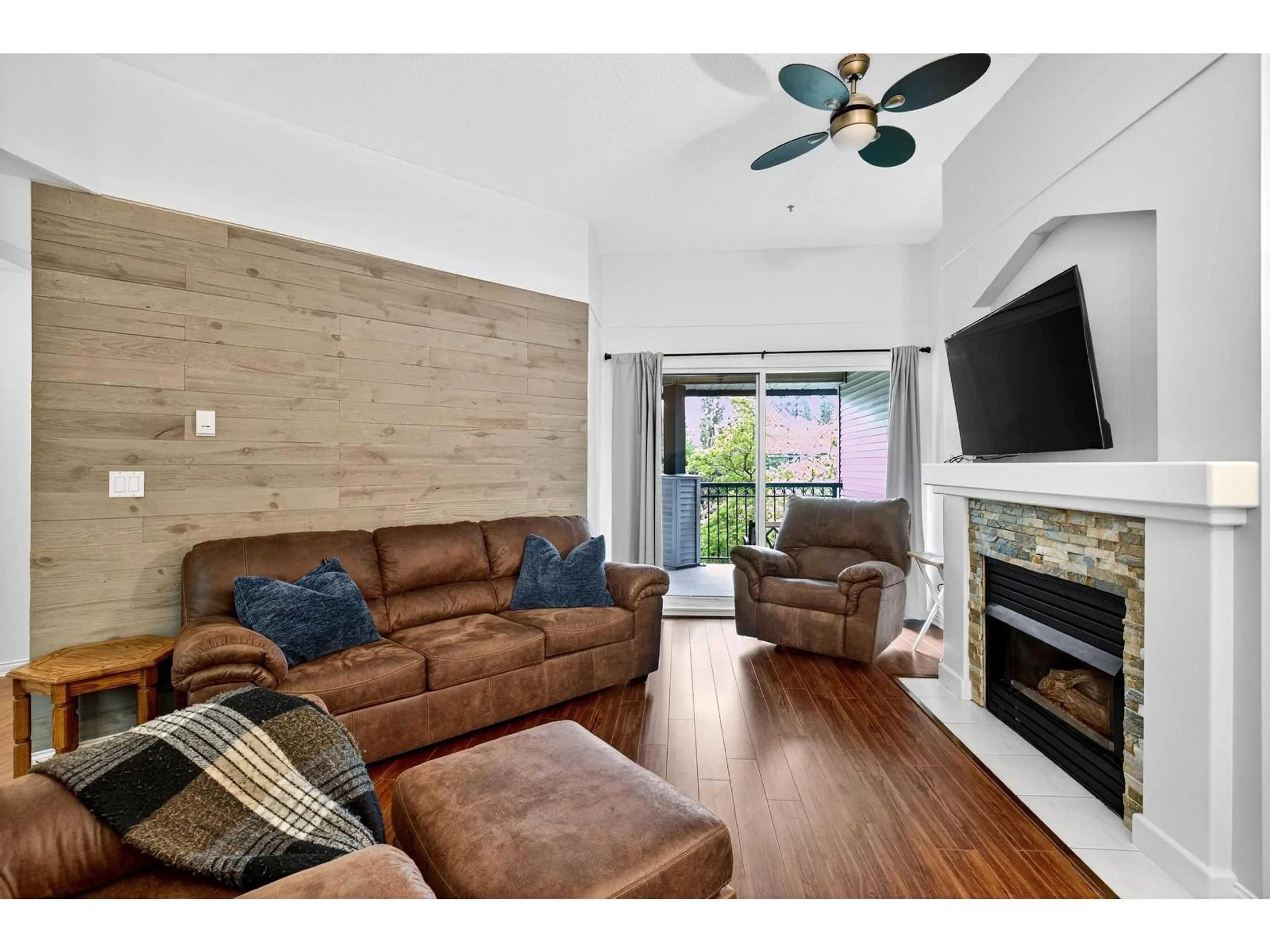 Living room with furniture, wood/laminate floor for 322 - 19528 FRASER, Surrey British Columbia V3S8P4