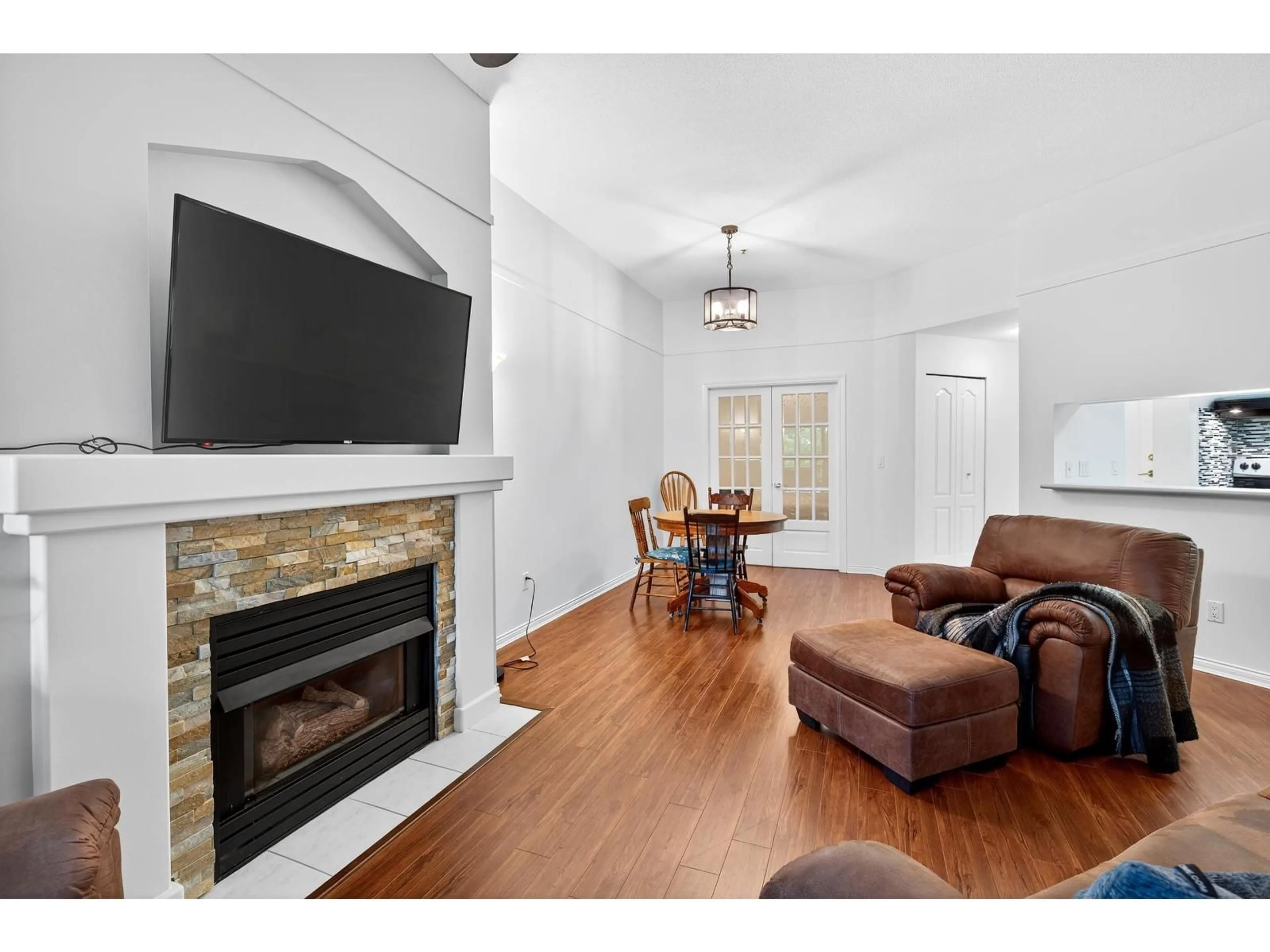 Living room with furniture, wood/laminate floor for 322 - 19528 FRASER, Surrey British Columbia V3S8P4