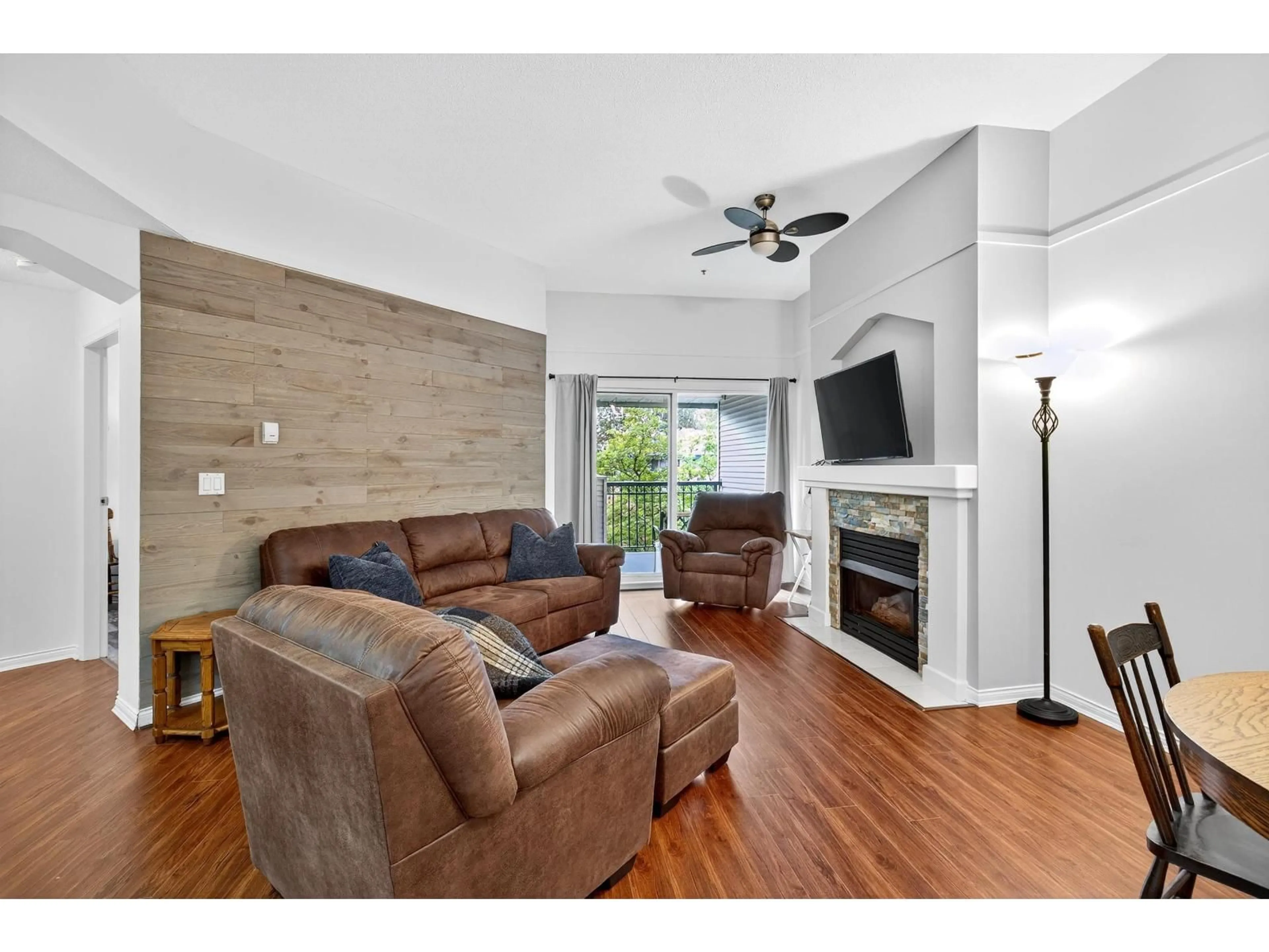 Living room with furniture, wood/laminate floor for 322 - 19528 FRASER, Surrey British Columbia V3S8P4