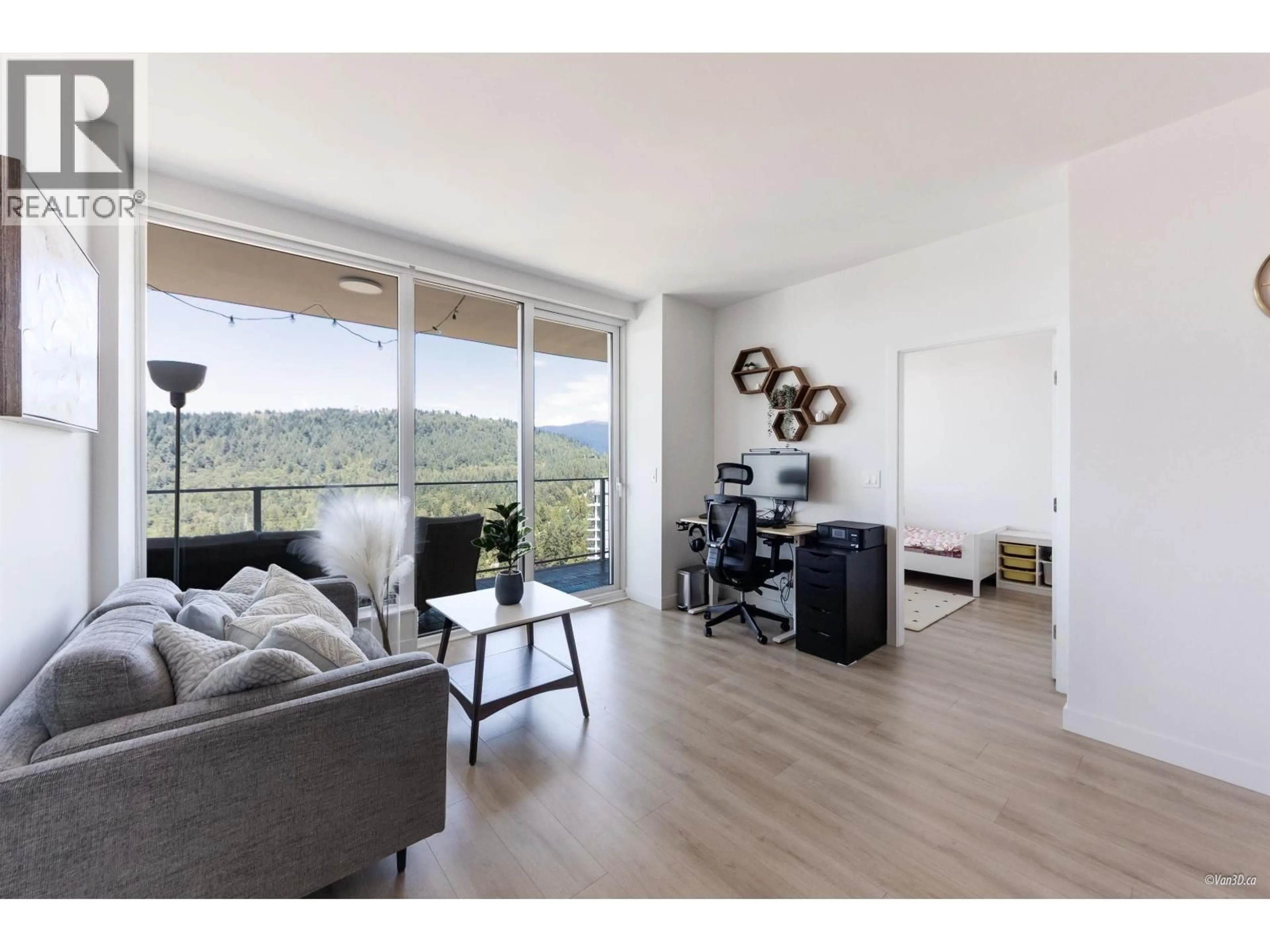 Living room with furniture, wood/laminate floor for 2703 - 567 CLARKE ROAD, Coquitlam British Columbia V3J0K7