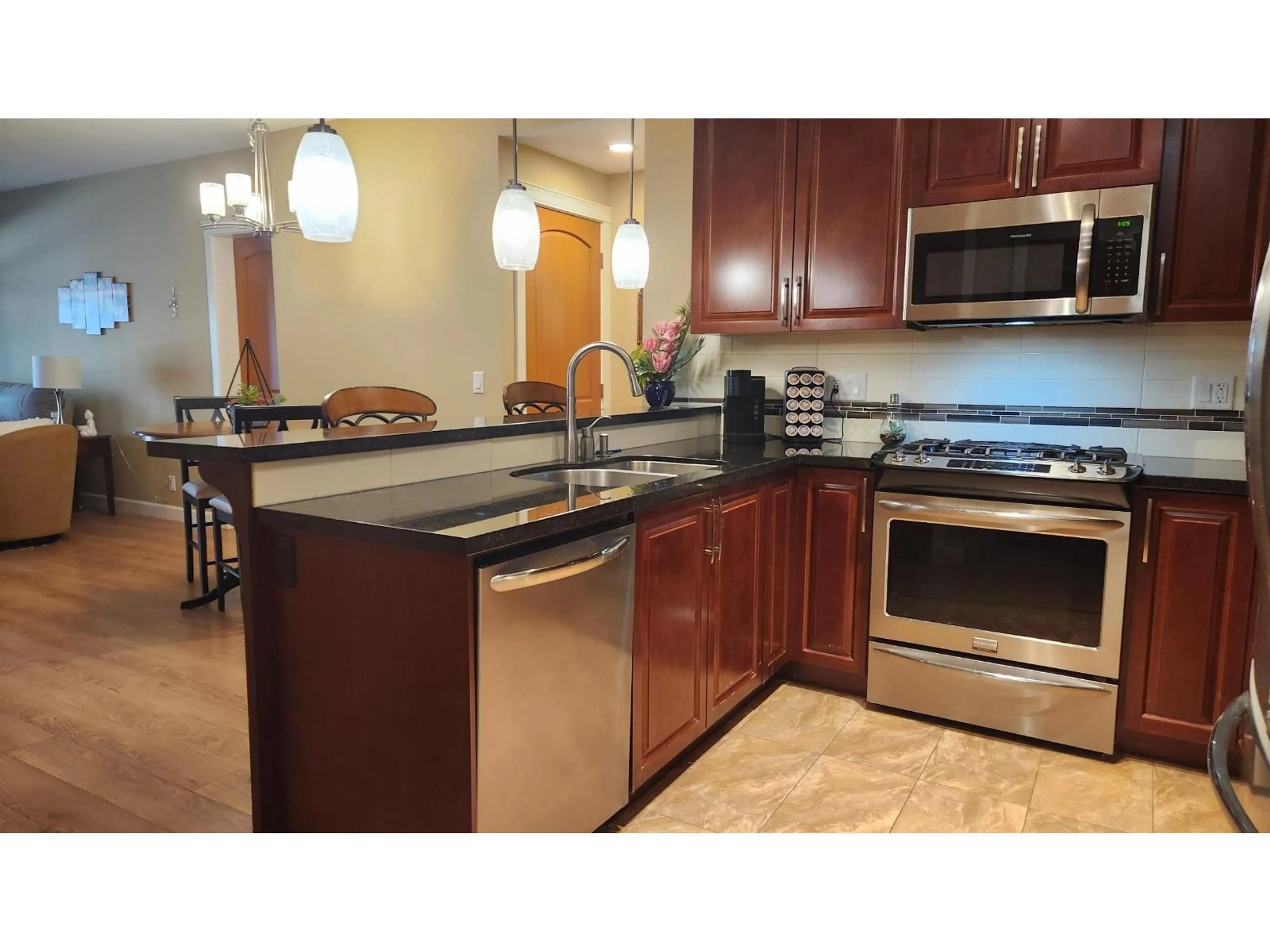 Open concept kitchen, ceramic/tile floor for A206 - 8218 207A, Langley British Columbia V2Y0X9