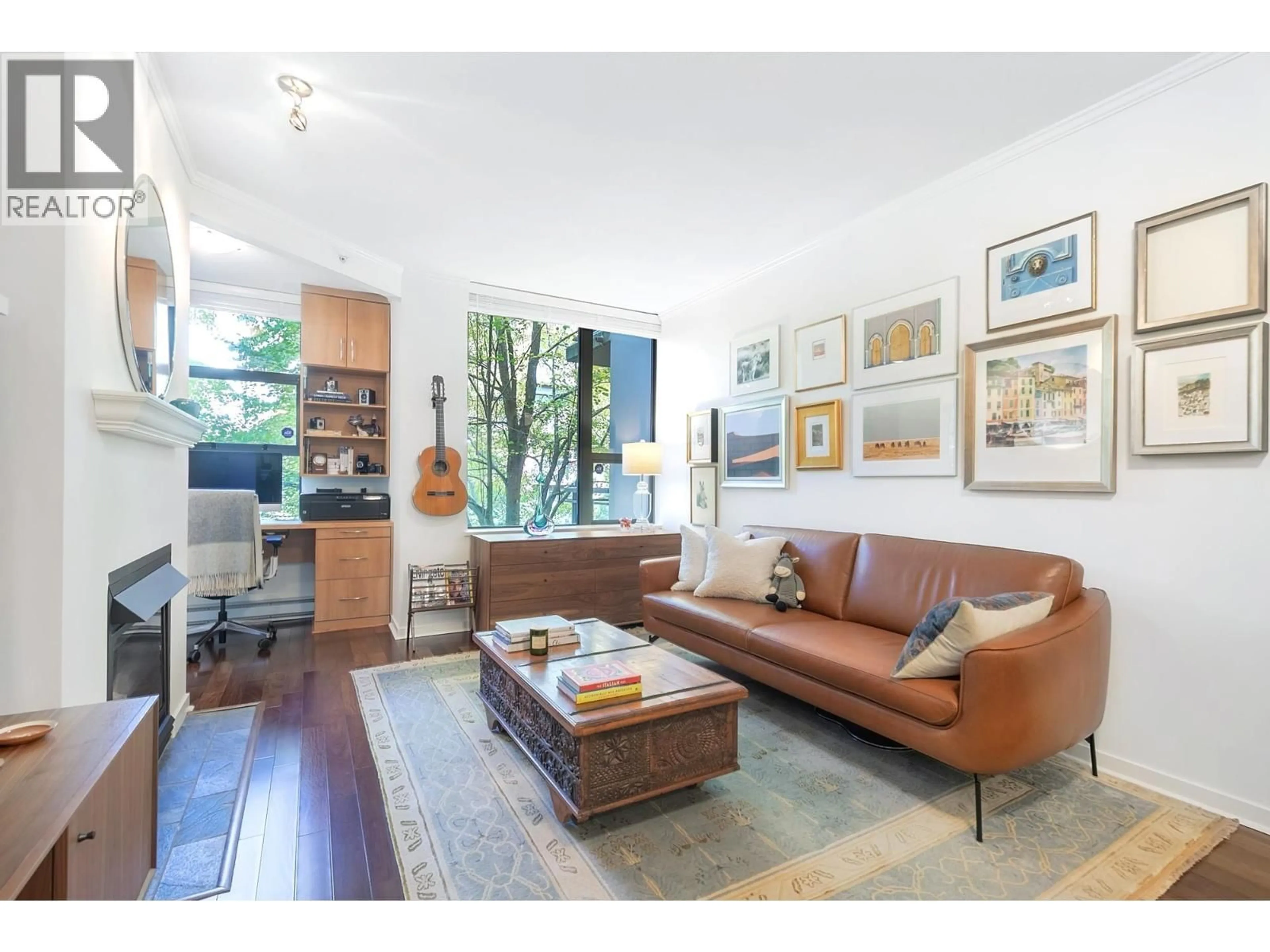 Living room with furniture, wood/laminate floor for 201 - 2263 REDBUD LANE, Vancouver British Columbia V6K4V7