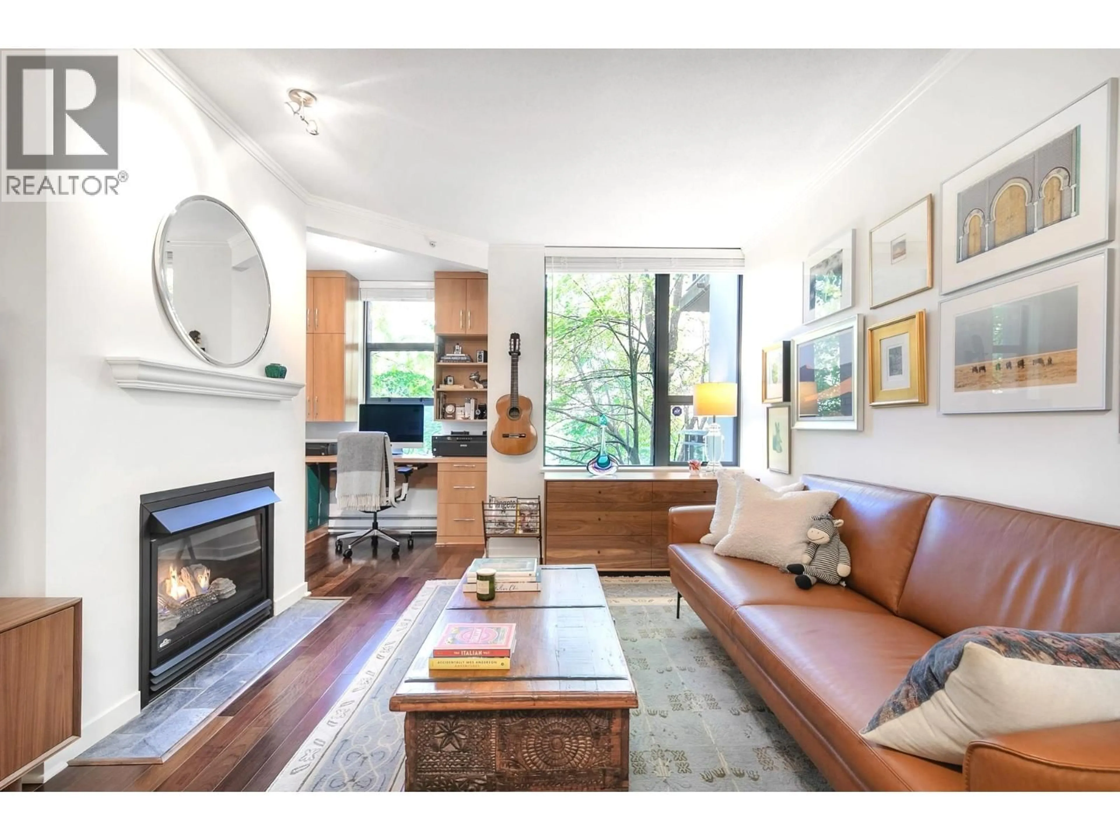 Living room with furniture, wood/laminate floor for 201 - 2263 REDBUD LANE, Vancouver British Columbia V6K4V7