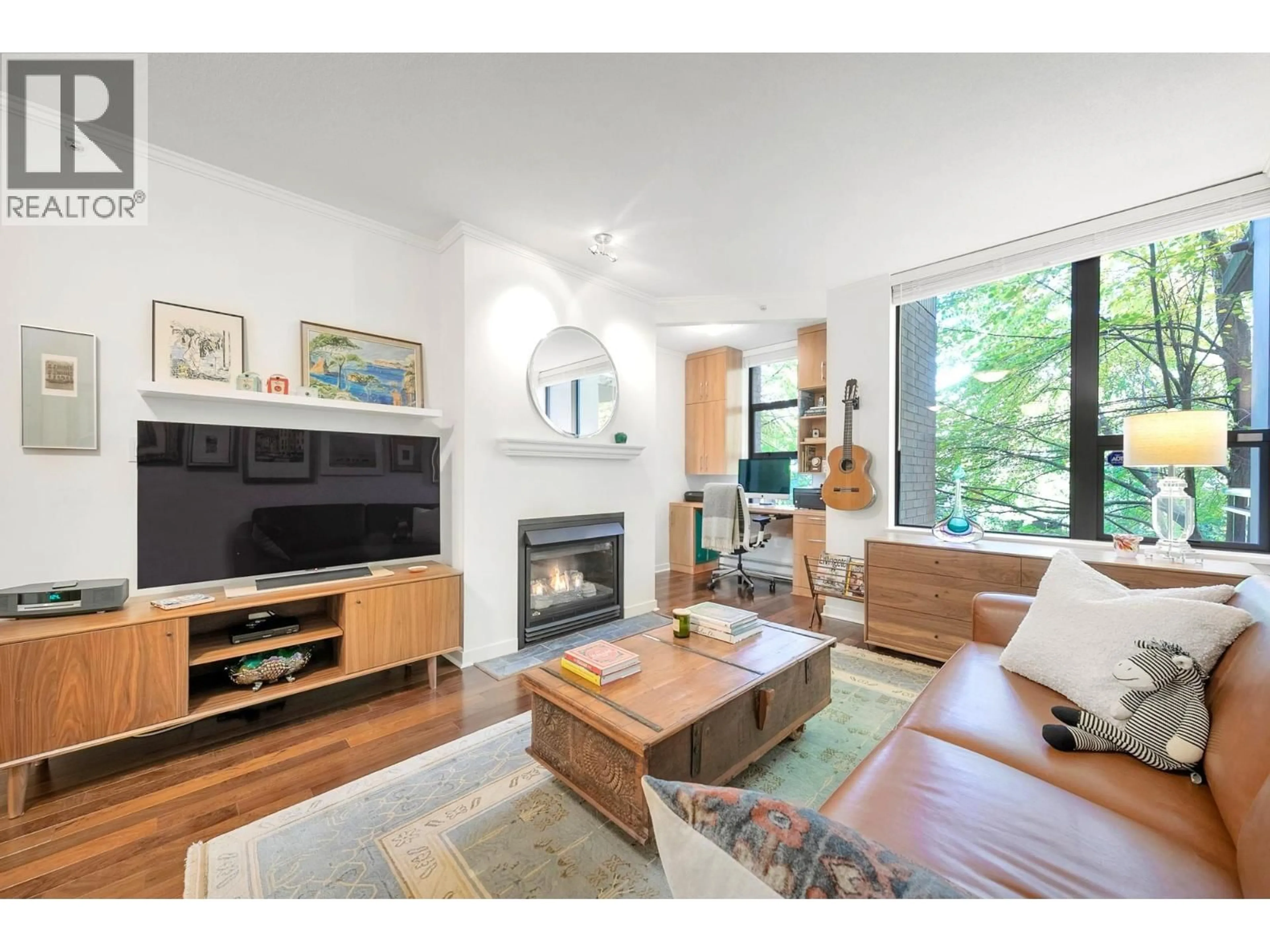Living room with furniture, wood/laminate floor for 201 - 2263 REDBUD LANE, Vancouver British Columbia V6K4V7