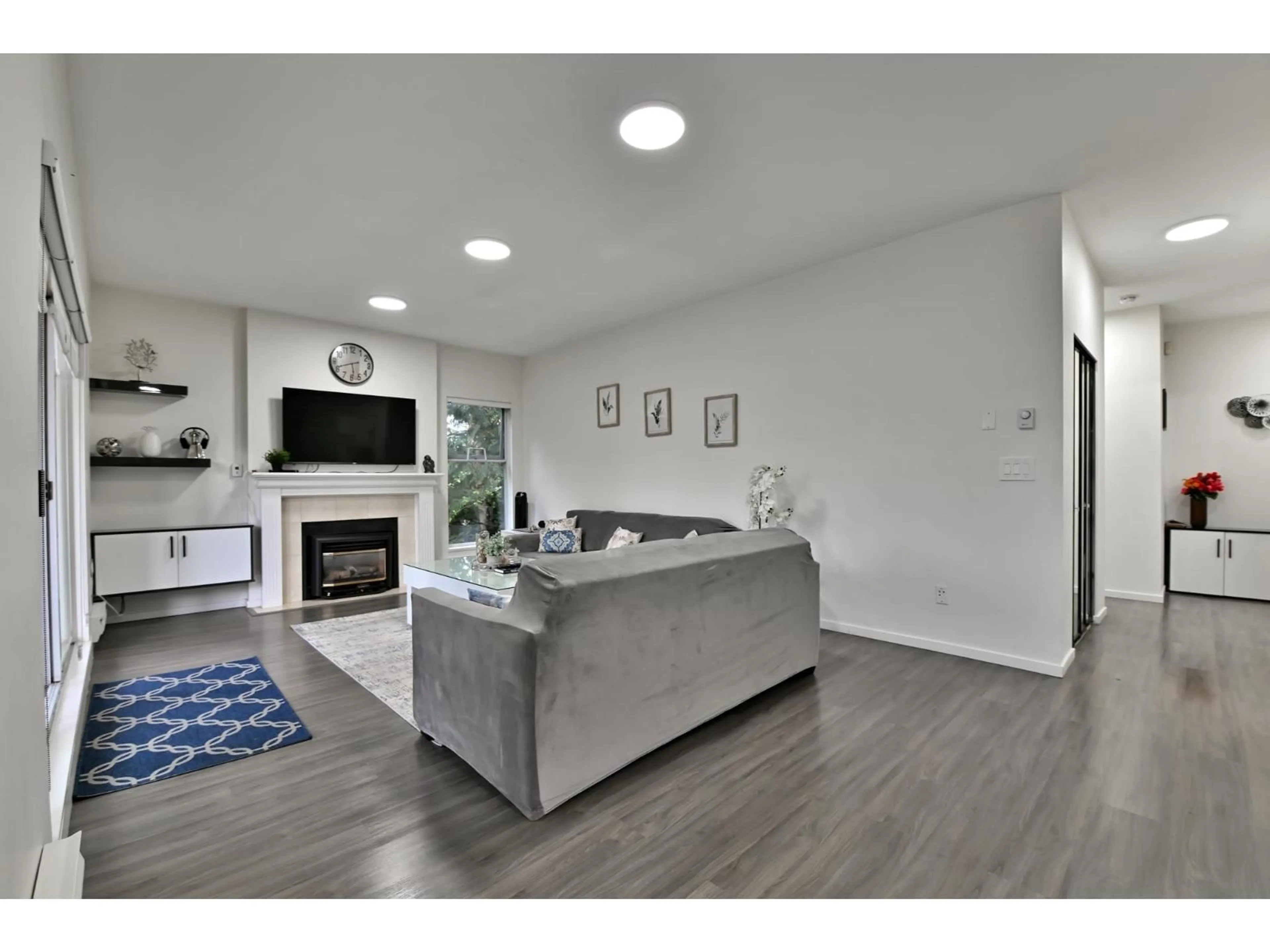 Living room with furniture, wood/laminate floor for 215 - 13918 72, Surrey British Columbia V3W0T4