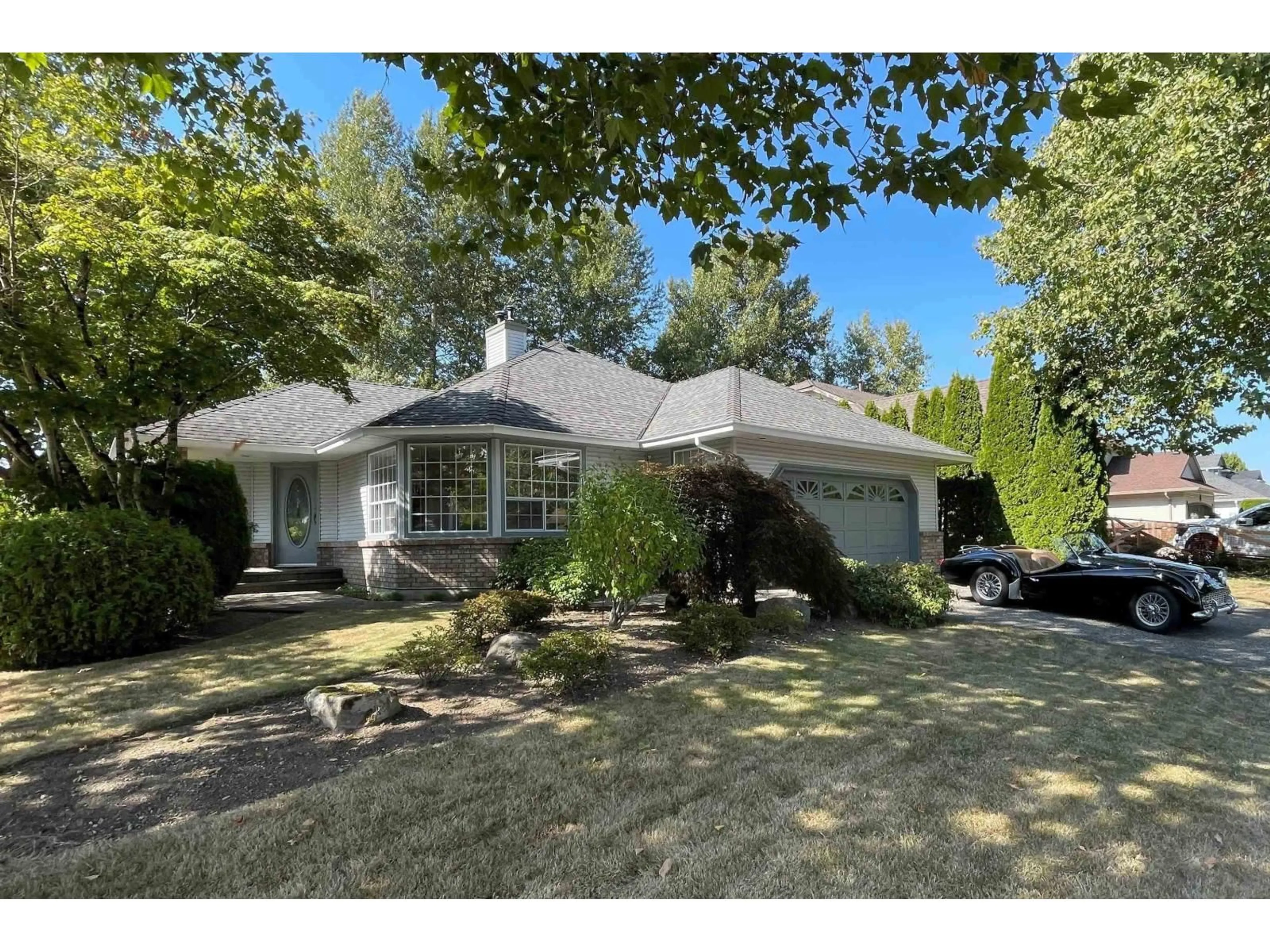 Home with vinyl exterior material, street for 8459 142A, Surrey British Columbia V2W0Z8