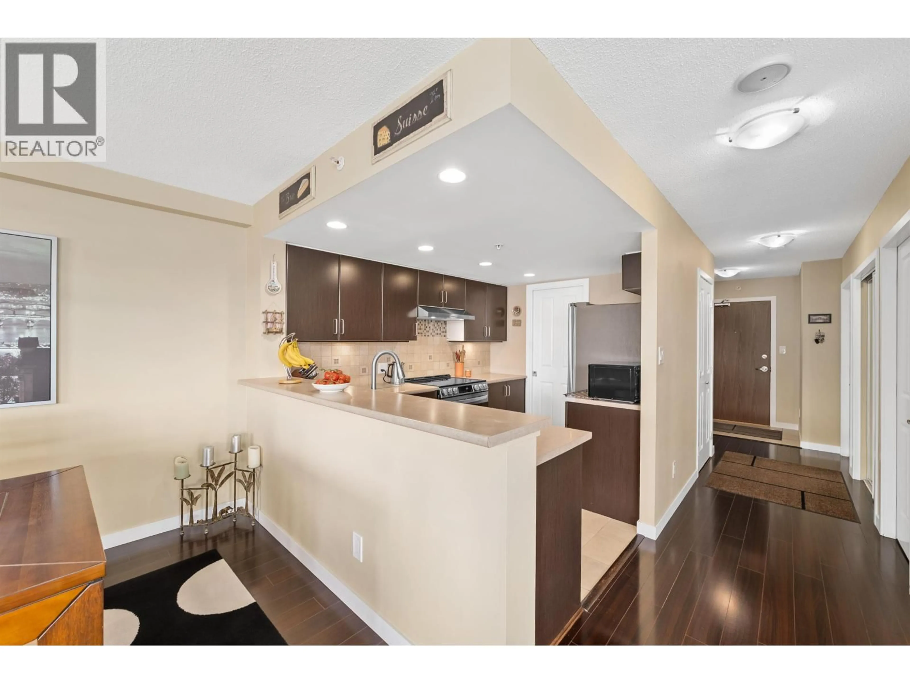 Open concept kitchen, wood/laminate floor for 405 - 295 GUILDFORD WAY, Port Moody British Columbia V3H5N3