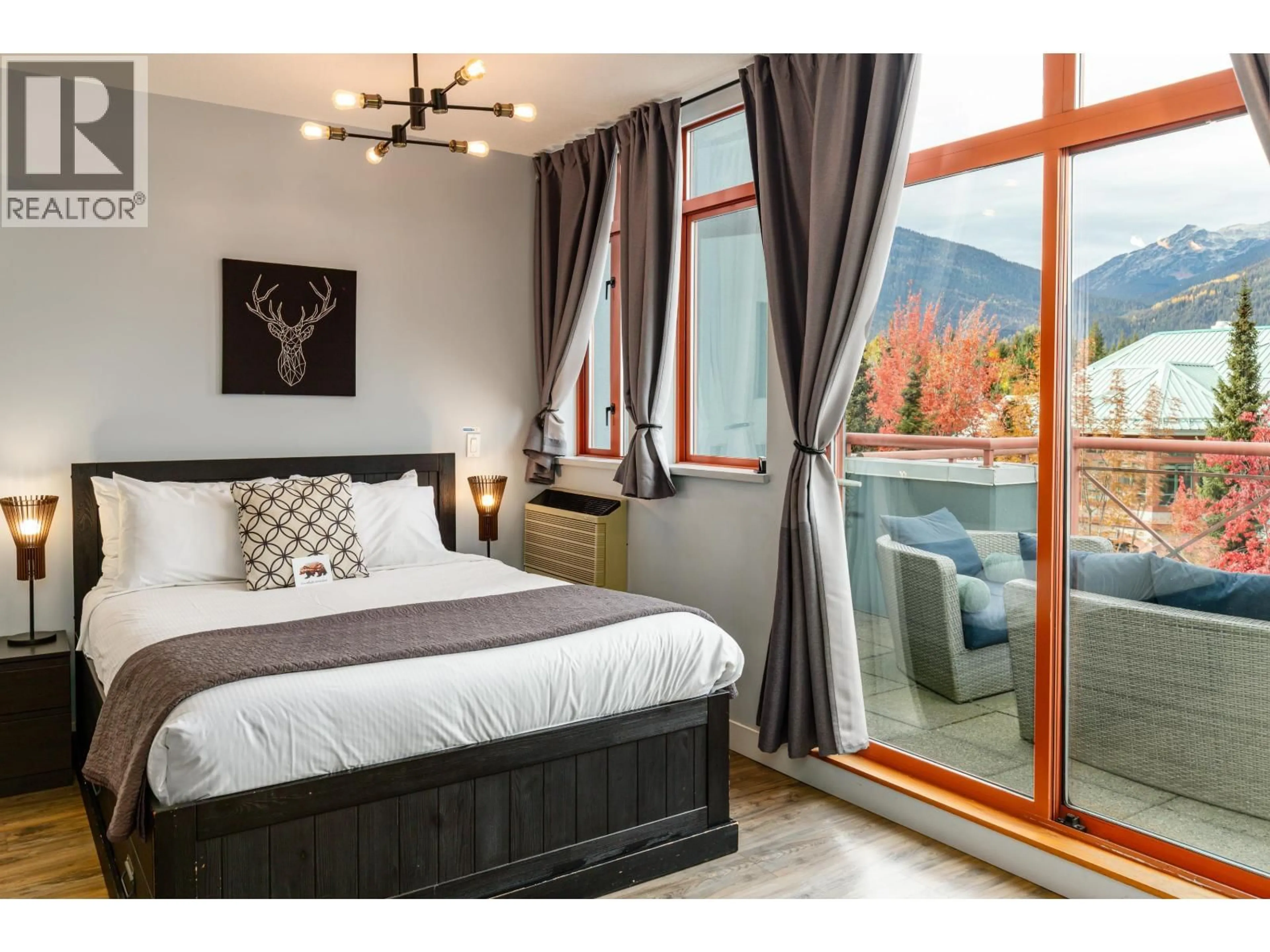 Bedroom with bed, wood/laminate floor for 420 - 4369 MAIN STREET, Whistler British Columbia V8E1B7