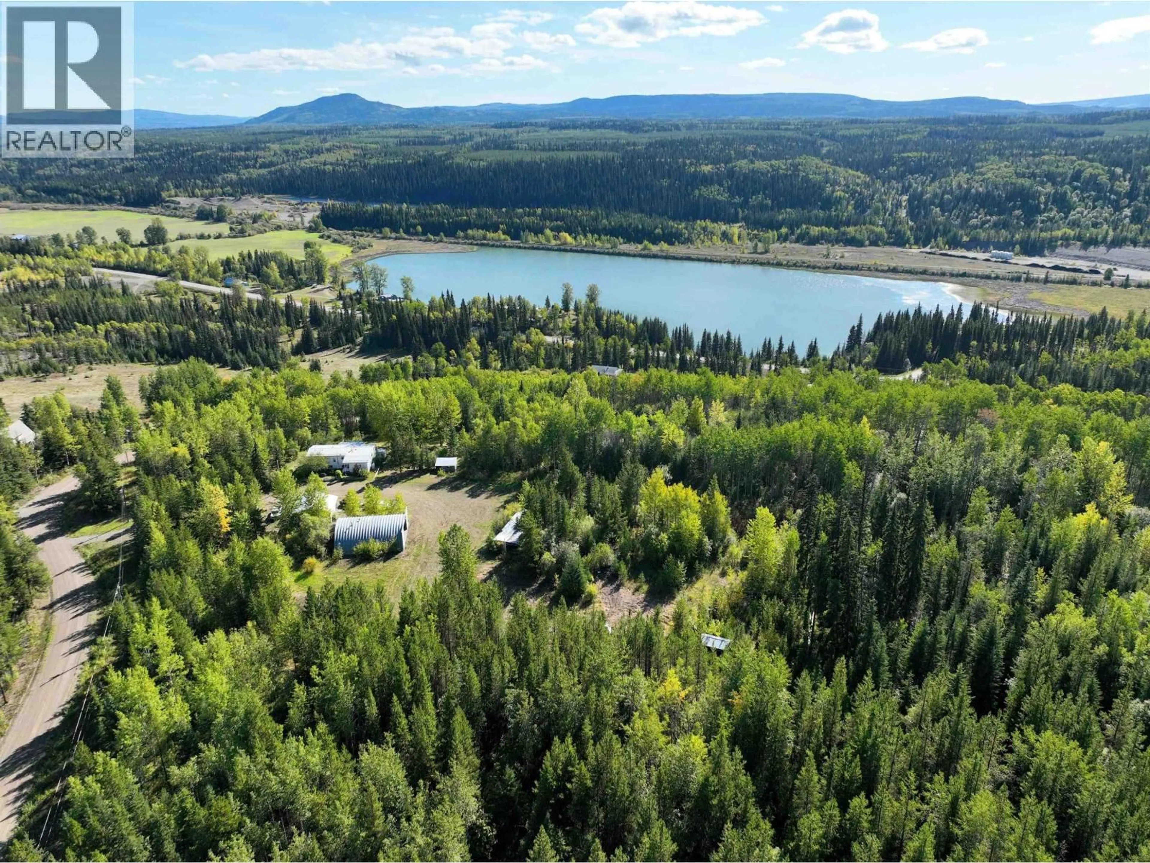 A pic from outside/outdoor area/front of a property/back of a property/a pic from drone, forest/trees view for 20655 HOSSACK ROAD, Burns Lake British Columbia V0J1E1