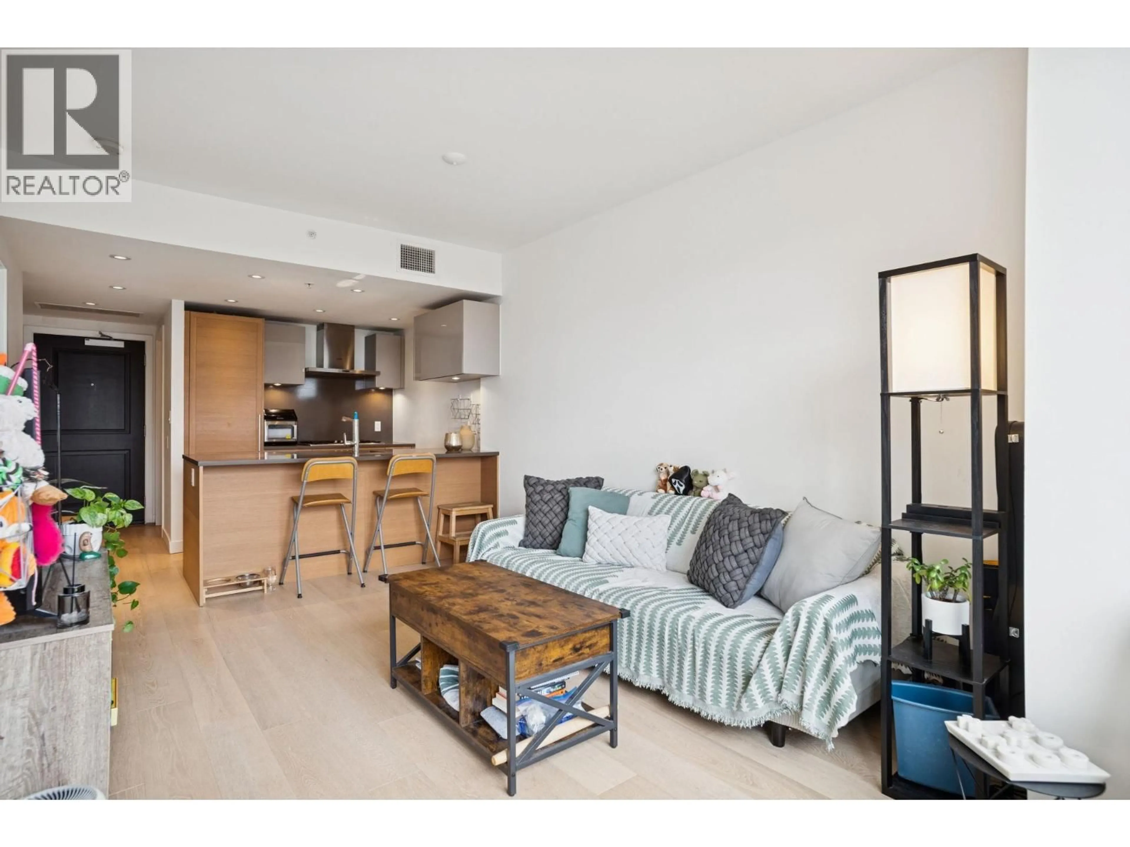 Living room with furniture, wood/laminate floor for 506 - 1515 ATLAS LANE, Vancouver British Columbia V6P0C9