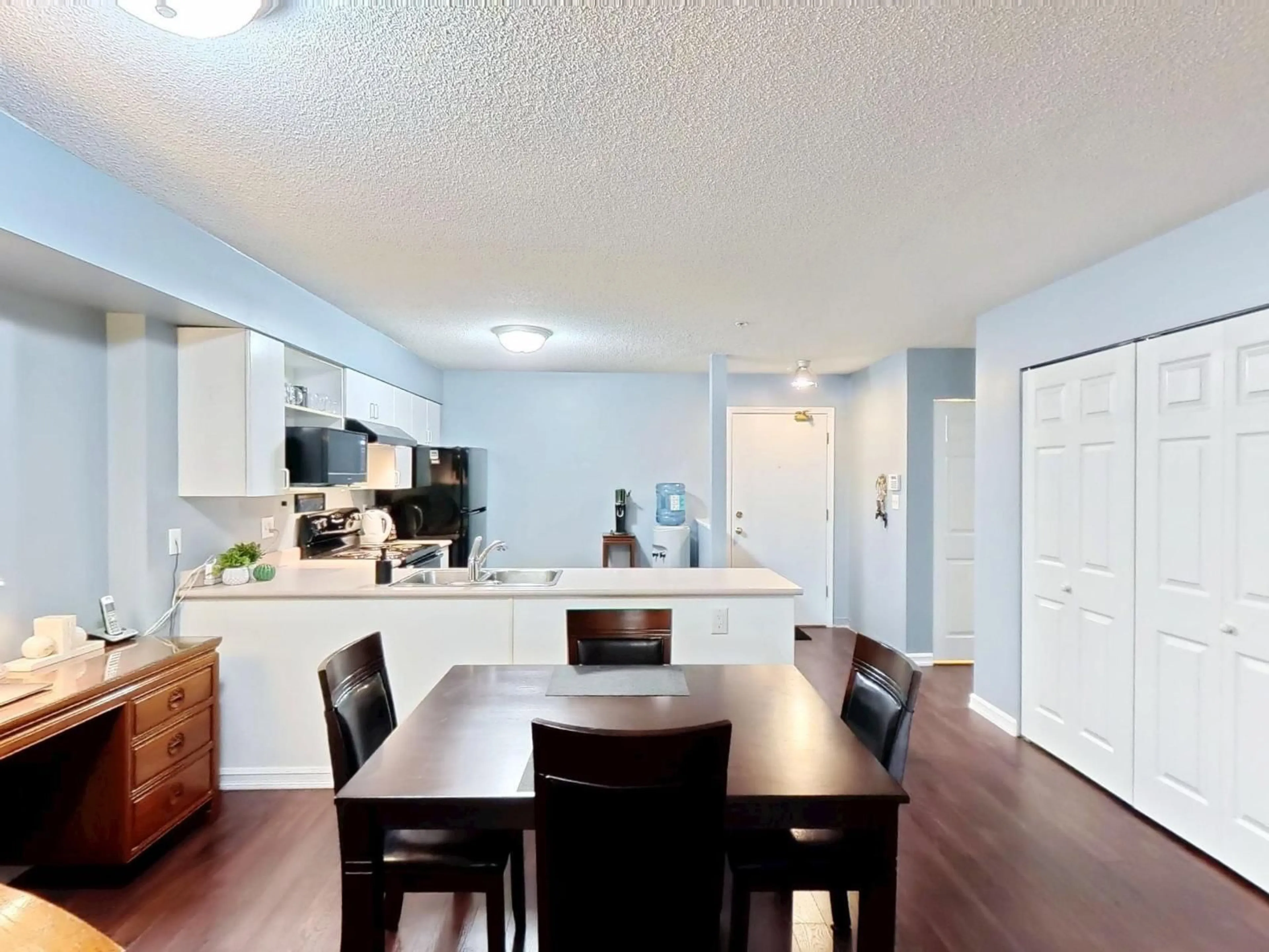 Open concept kitchen, wood/laminate floor for 102 - 12130 80, Surrey British Columbia V3W0V2